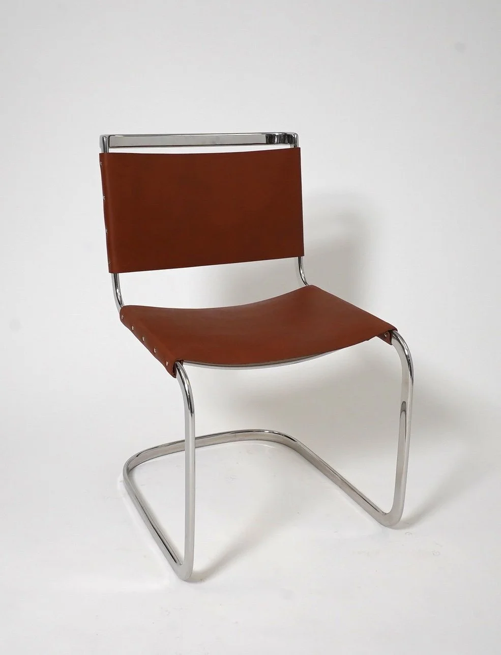 Cognac Leather Cantilever Chair, $150, H35" x W20" x D25", 4 Total