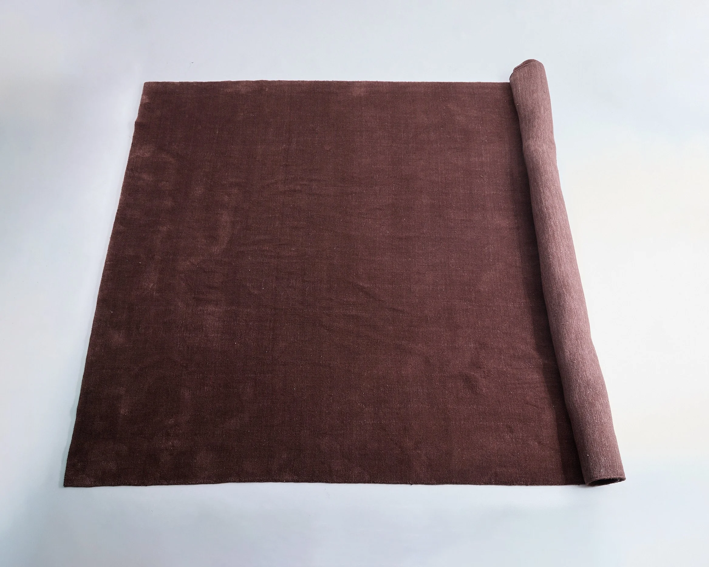 CHOCOLATE WOOL RUG, $350, 120”x 165”