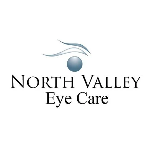 Logo for North Valley Eye Care featuring a stylized eye with curved lines and a circle.