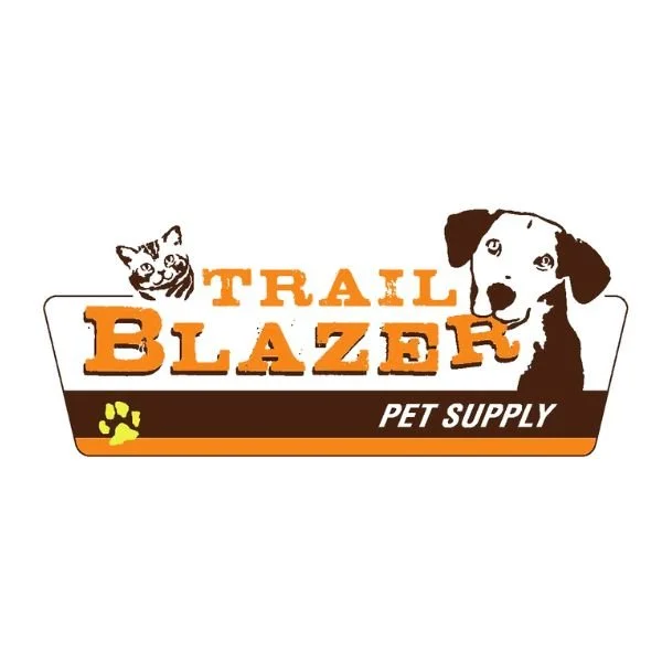 Logo for Trail Blazer Pet Supply featuring a rising cat on the left and a dog on the right, with the brand name in bold orange letters and a black and orange paw print.