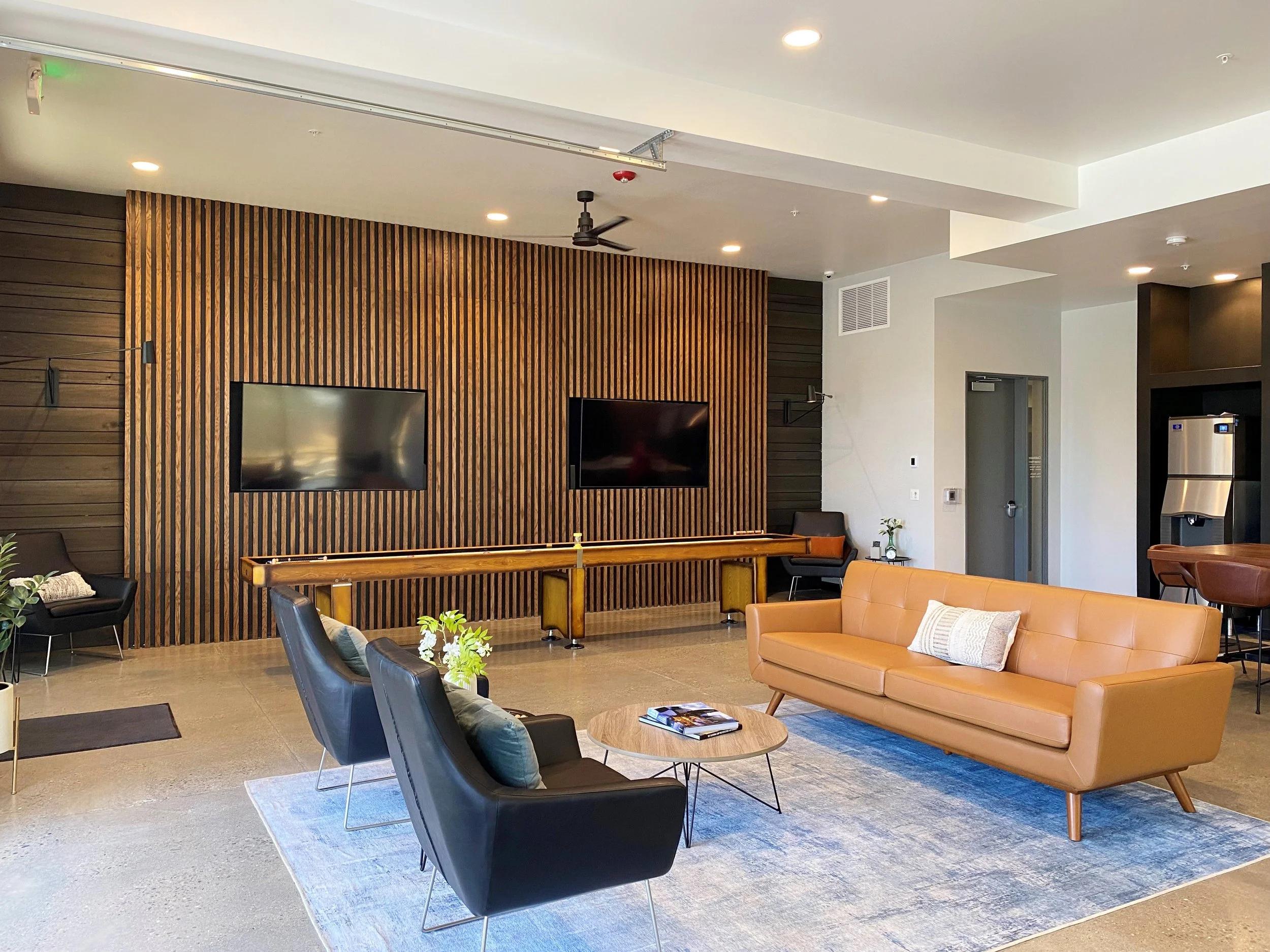 Shuffleboard + Sitting Area in Clubhouse Lounge