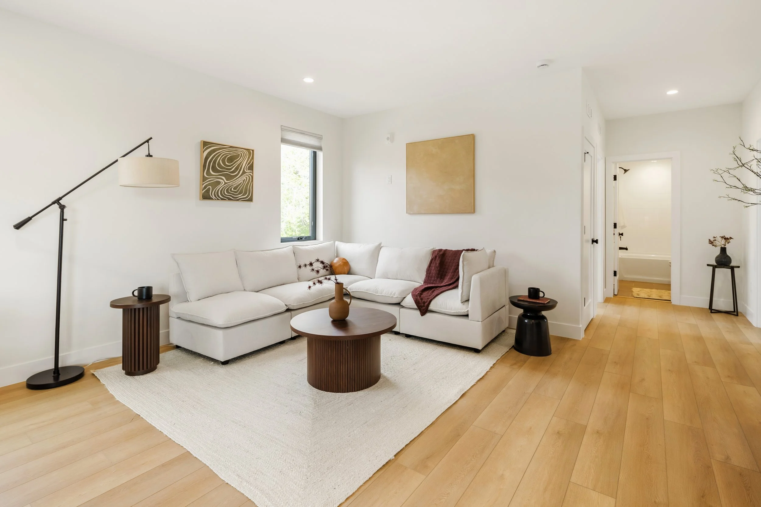 Living room in 1,352 square foot 2-bedroom Denver condo at Berkeley Residences with modern interior design