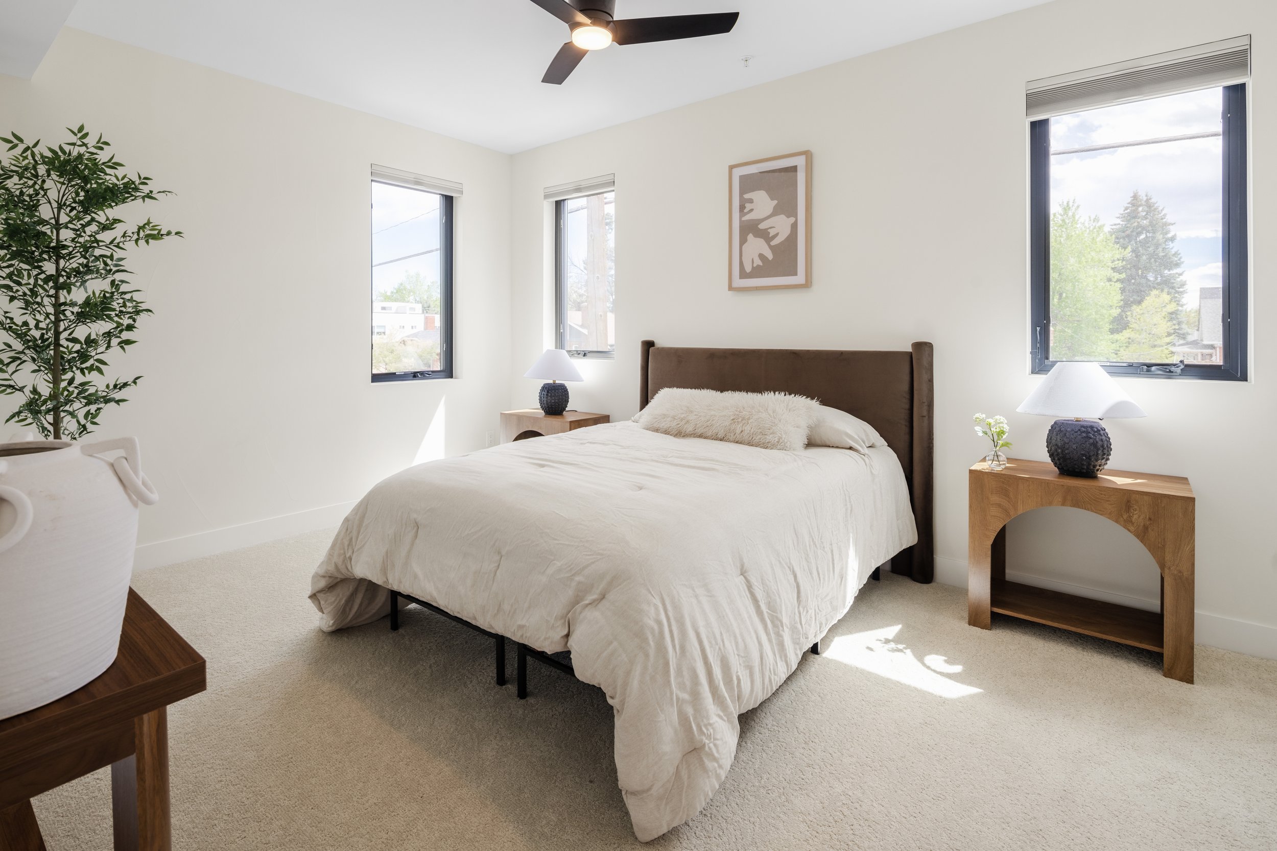 Primary bedroom in 1,313 SF 2-bed unit at Berkeley Residences Denver showing modern finishes and natural light