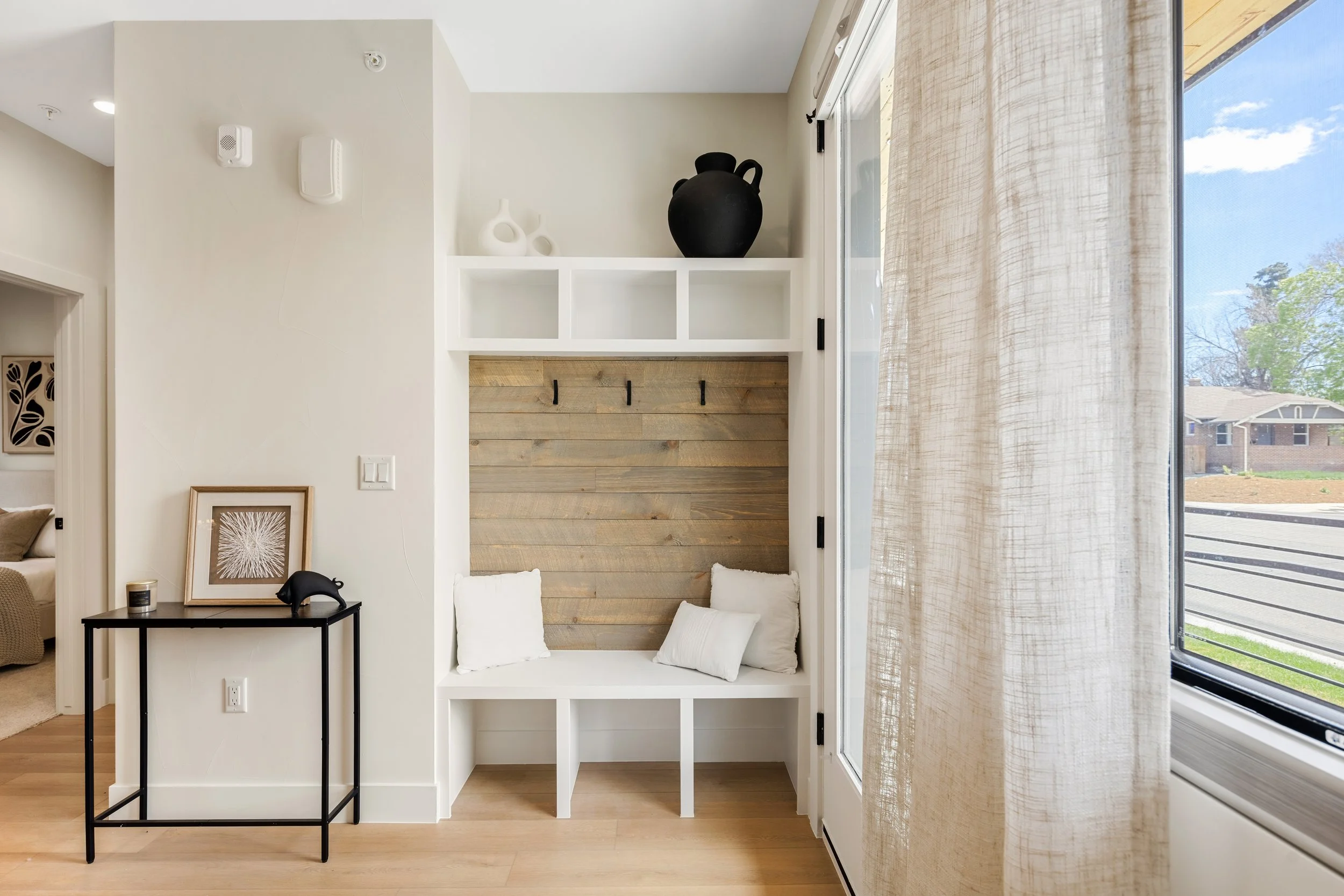 Entryway and hall in 1-bedroom unit at Berkeley Residences showing clean modern design and efficient layout in Denver condo