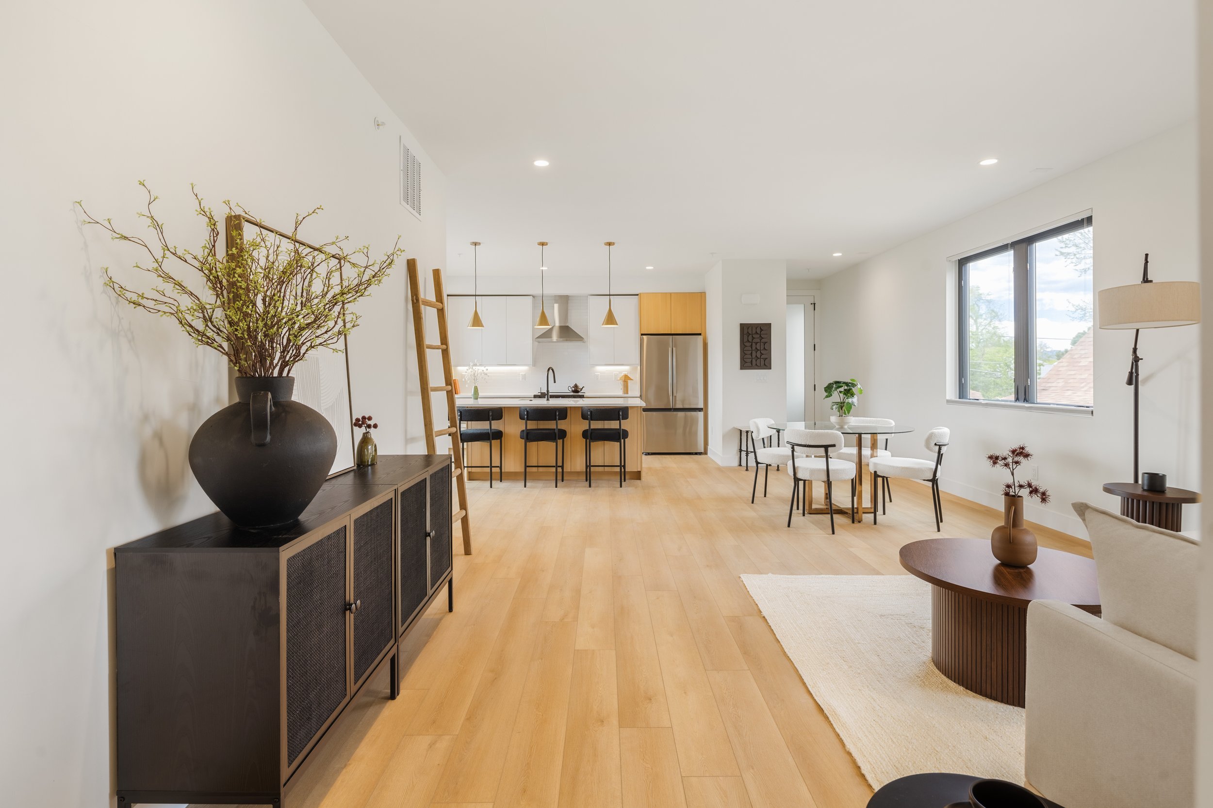 Living room in 1,313 square foot 2-bedroom Denver condo at Berkeley Residences with modern interior design