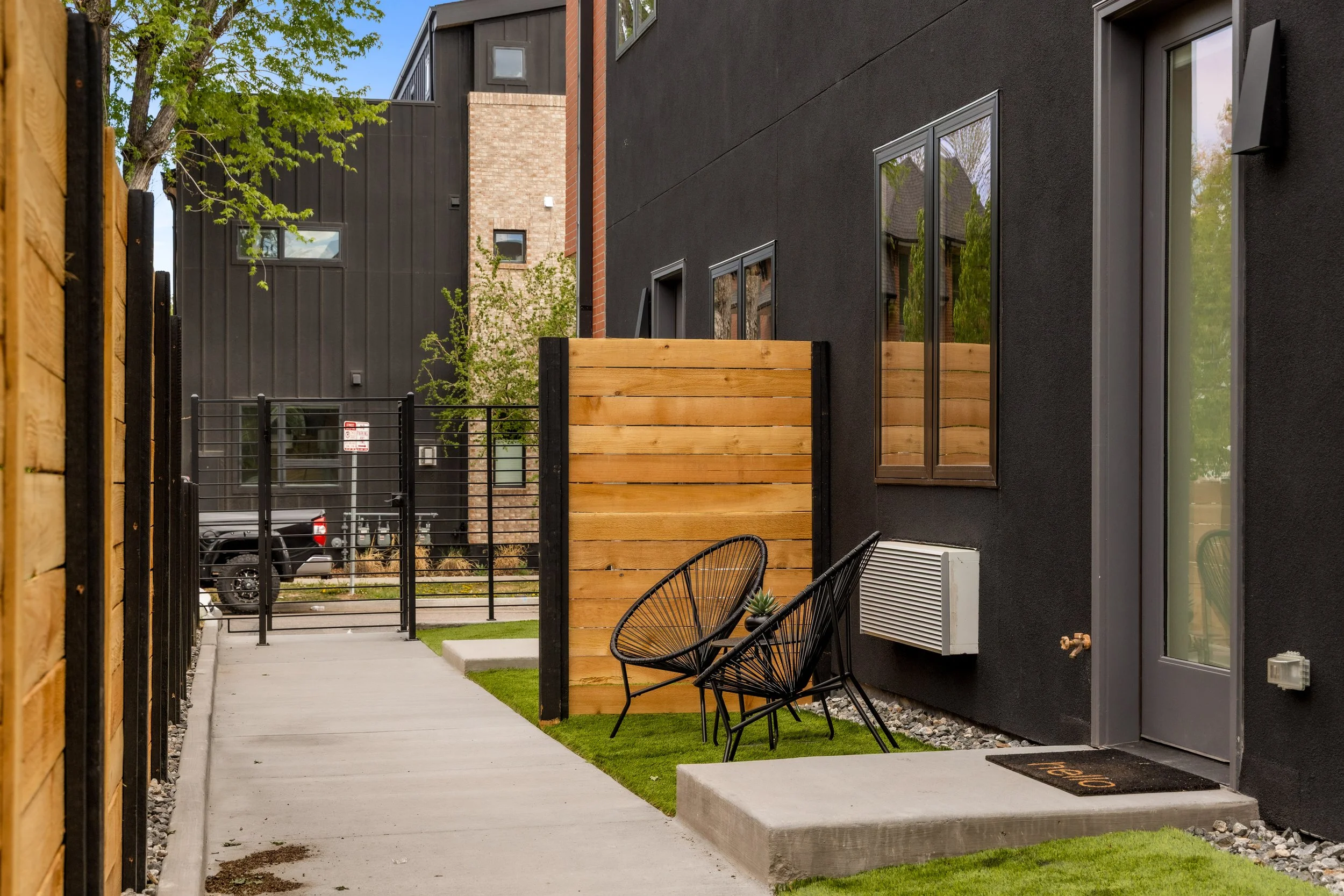 Entrance and garage area of Berkeley Residences luxury Denver condos at 3825 W 38th Ave with modern architectural detailing