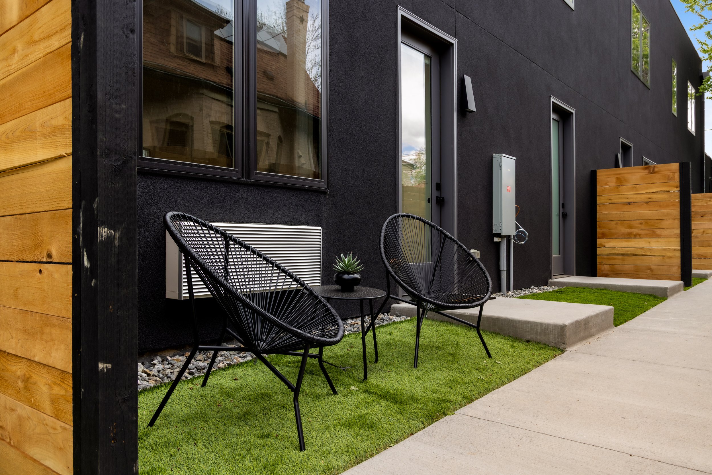 Close-up detail of Berkeley Residences contemporary exterior showing brick, metal accents, and recessed lighting on Denver W 38th location