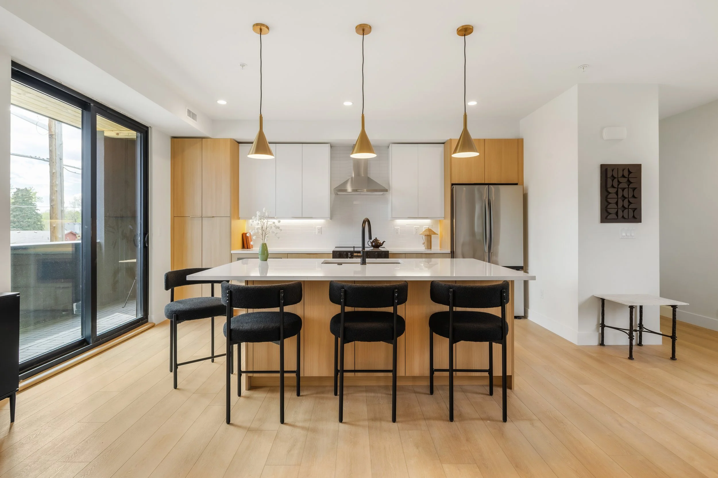 Dining and living area in 2-bed residence at Berkeley Residences showing contemporary design and floor-to-ceiling windows