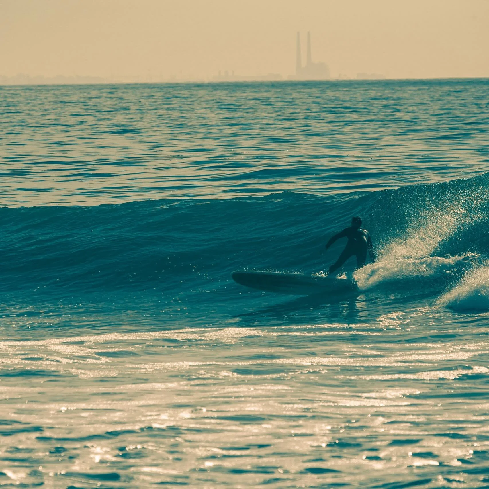 [FROM THE ARCHIVES]
Dec 2013 California Coast. Grew up in a beach town/surf culture in New Smyrna Beach, FL, but you don&rsquo;t get a power plant beyond the break view there&hellip; it&rsquo;s what makes this image for me. 
.
.
.
#california #surfin