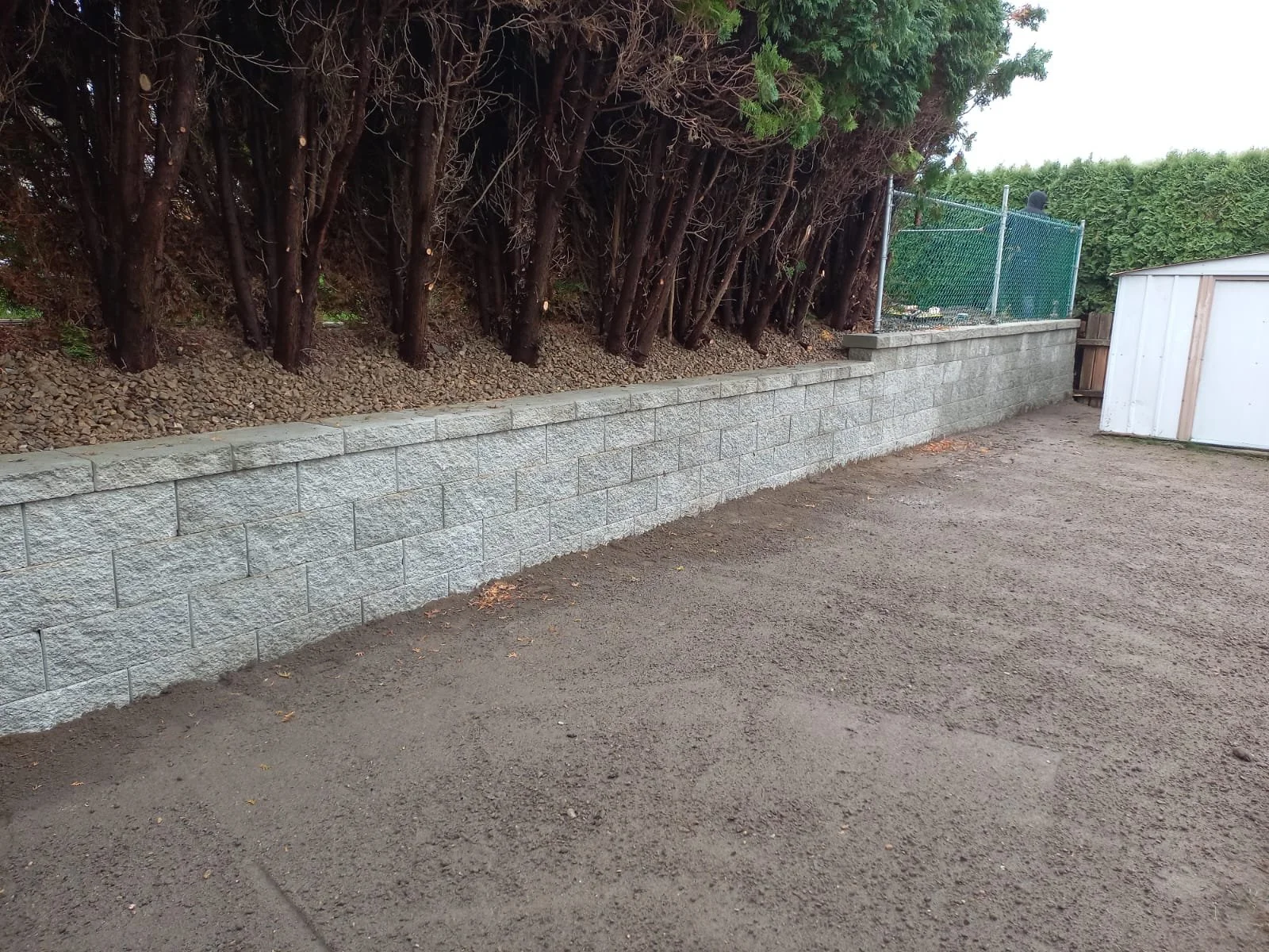 Retaining wall rebuild designed to improve slope stability, drainage, and long-term performance.