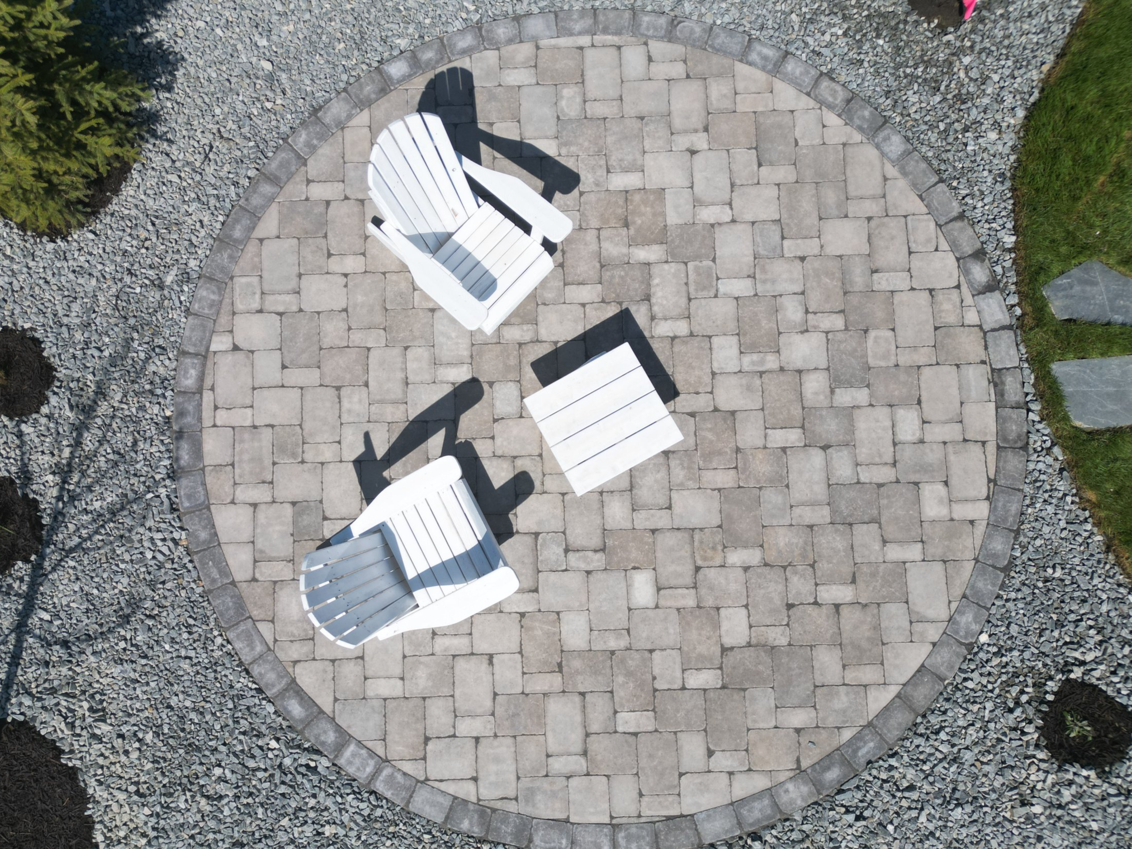 Custom circular paver patio and outdoor fire pit area in Blind Bay, BC