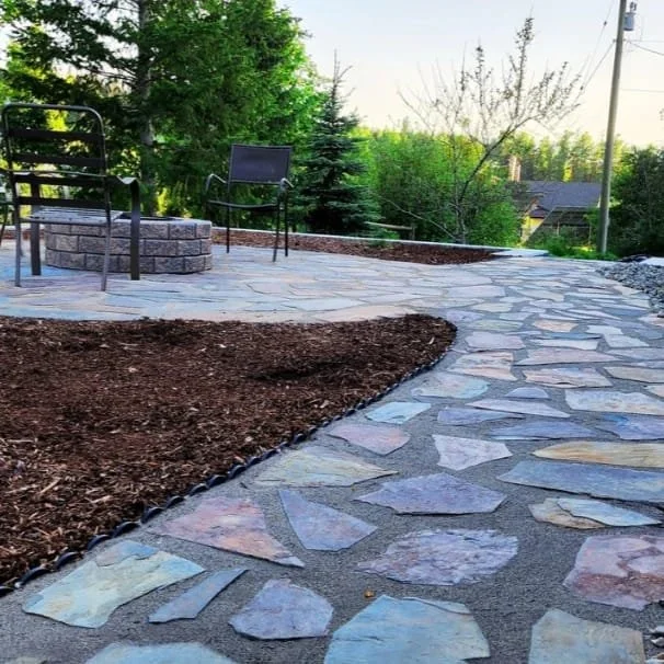 Custom flagstone pathway installation by Monarca Landscaping in Salmon Arm BC.