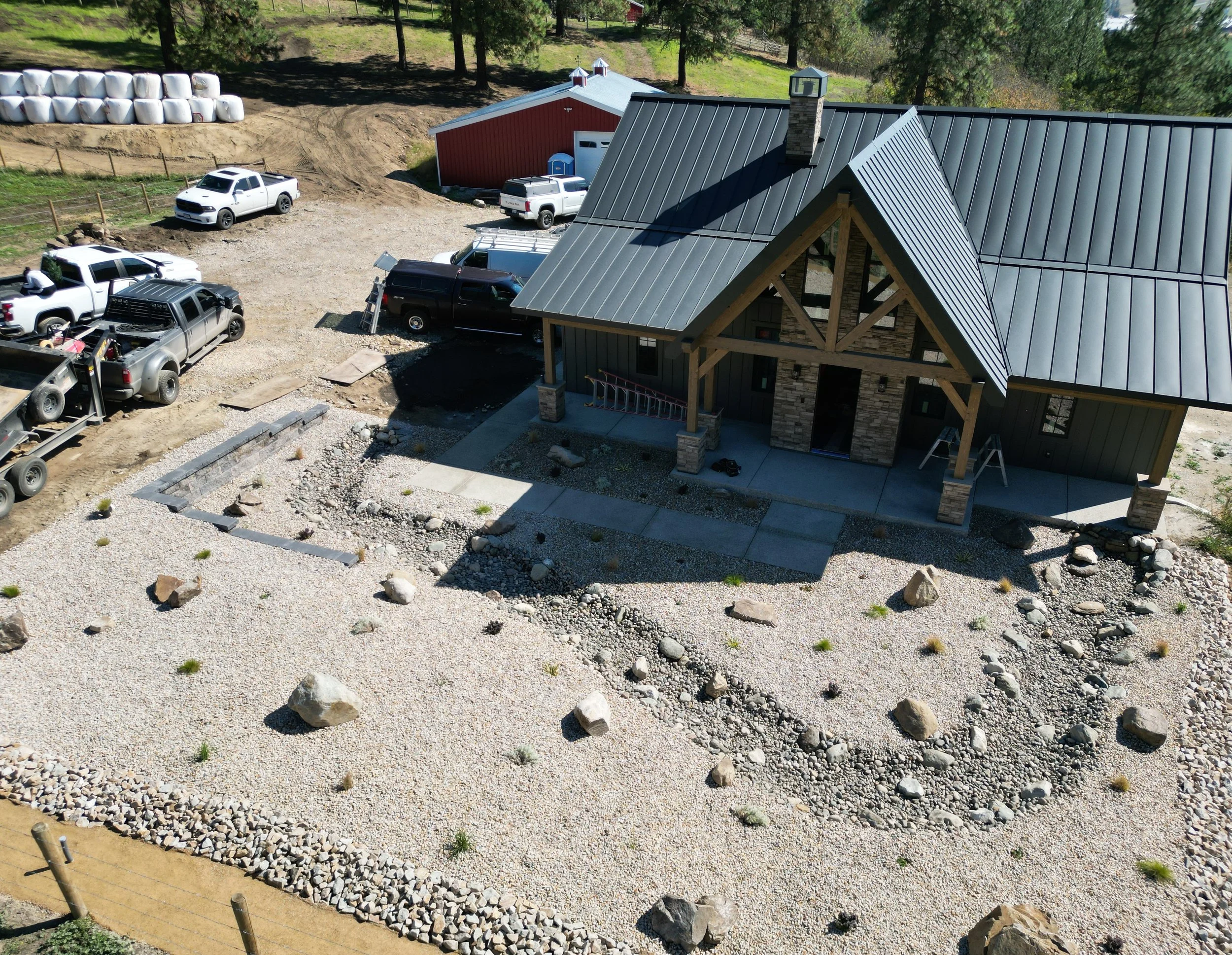 Xeriscape landscaping in Armstrong, BC featuring decorative rock, drought-tolerant plants, and a low-maintenance landscape design.