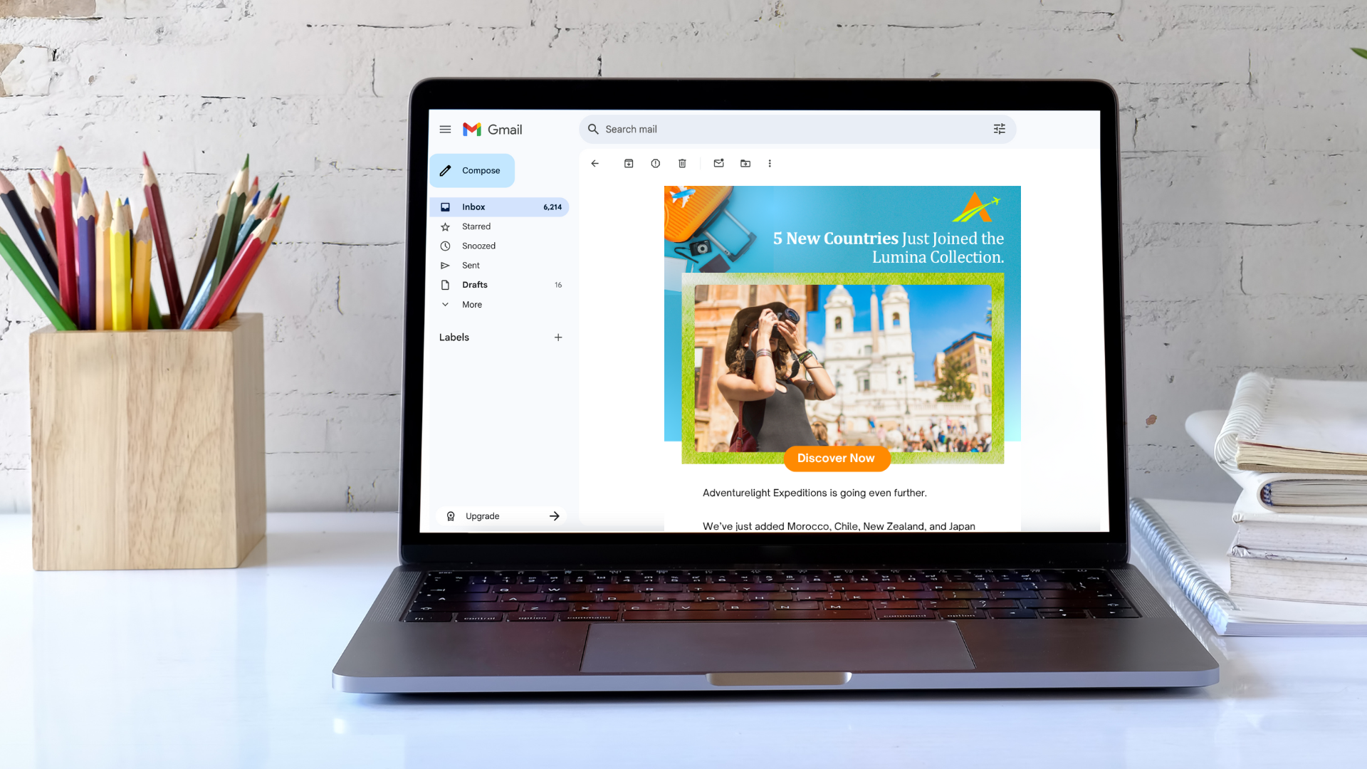 Laptop displaying an email with a travel advertisement for new countries.