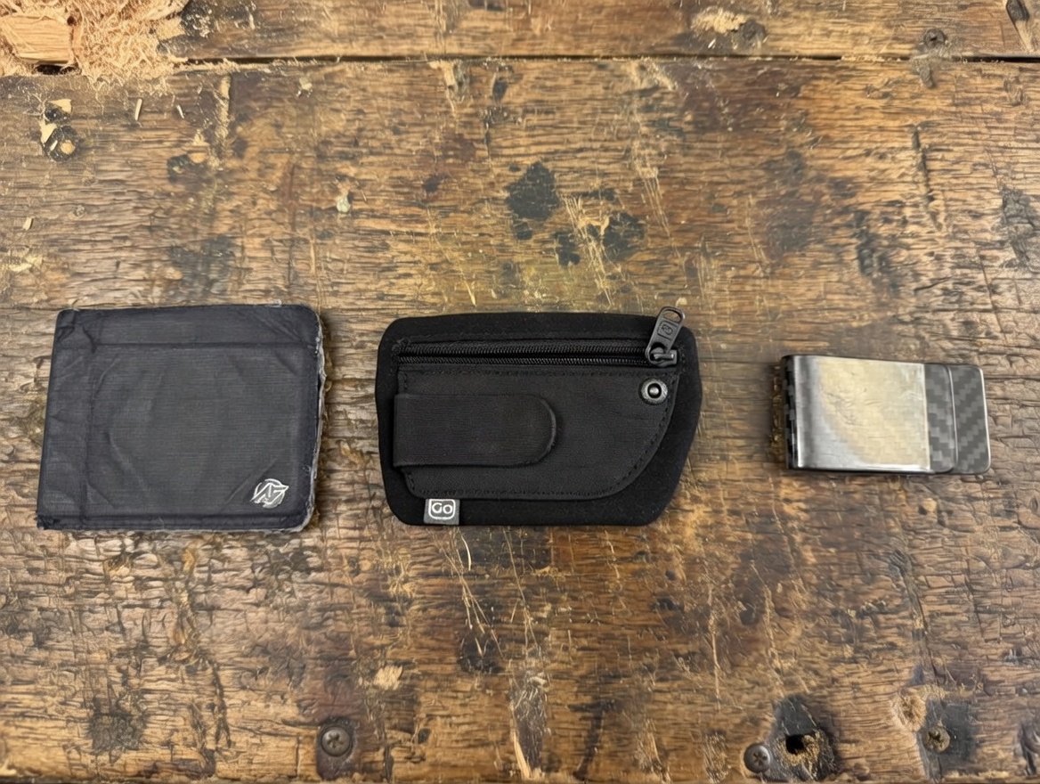 The best travel wallet is not one wallet. It is a system.