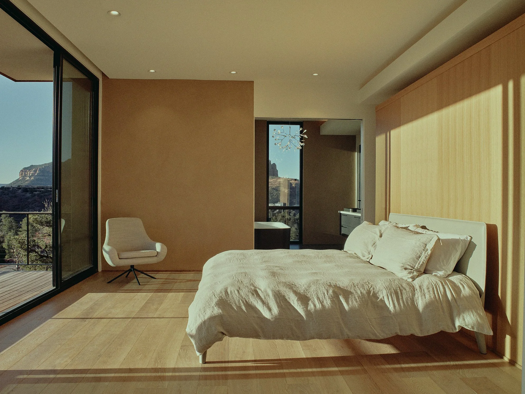 quiet primary bedroom inspo warm linen finishes interior design open concept contemporary home