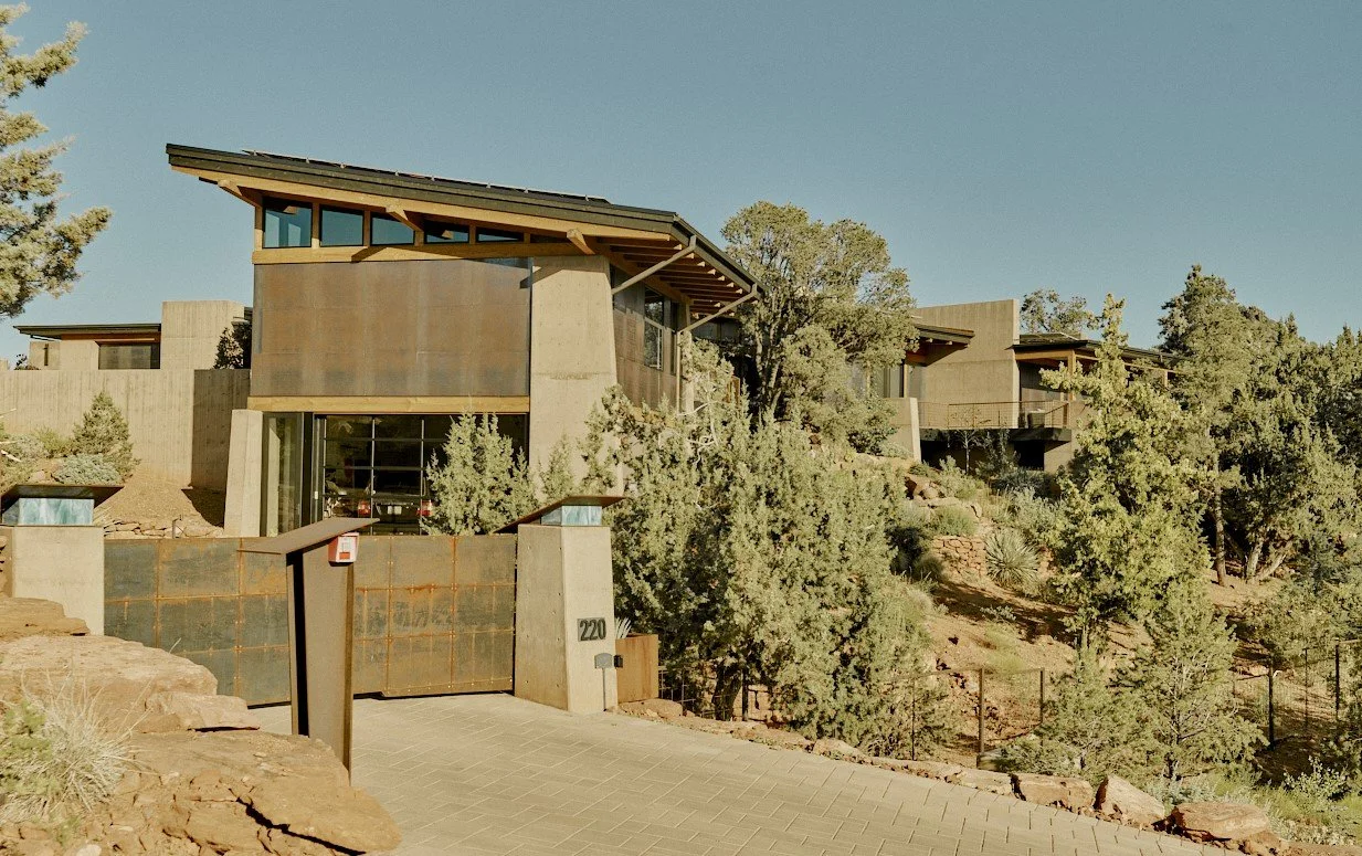 Private entry drive to a beautiful craftsman style residence, surrounded by native planting. 