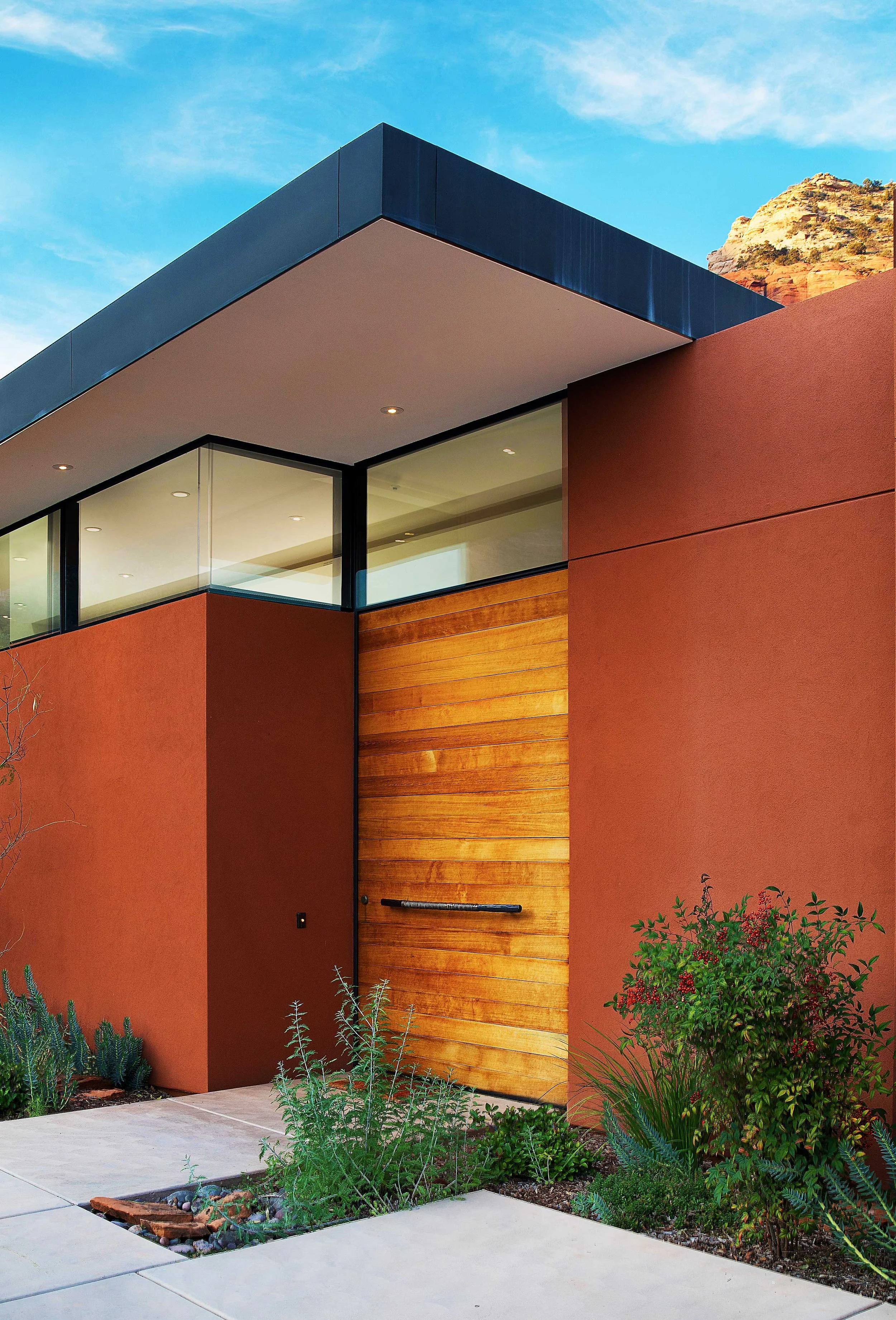 clerestory windows large wooden pivot door modern architecture