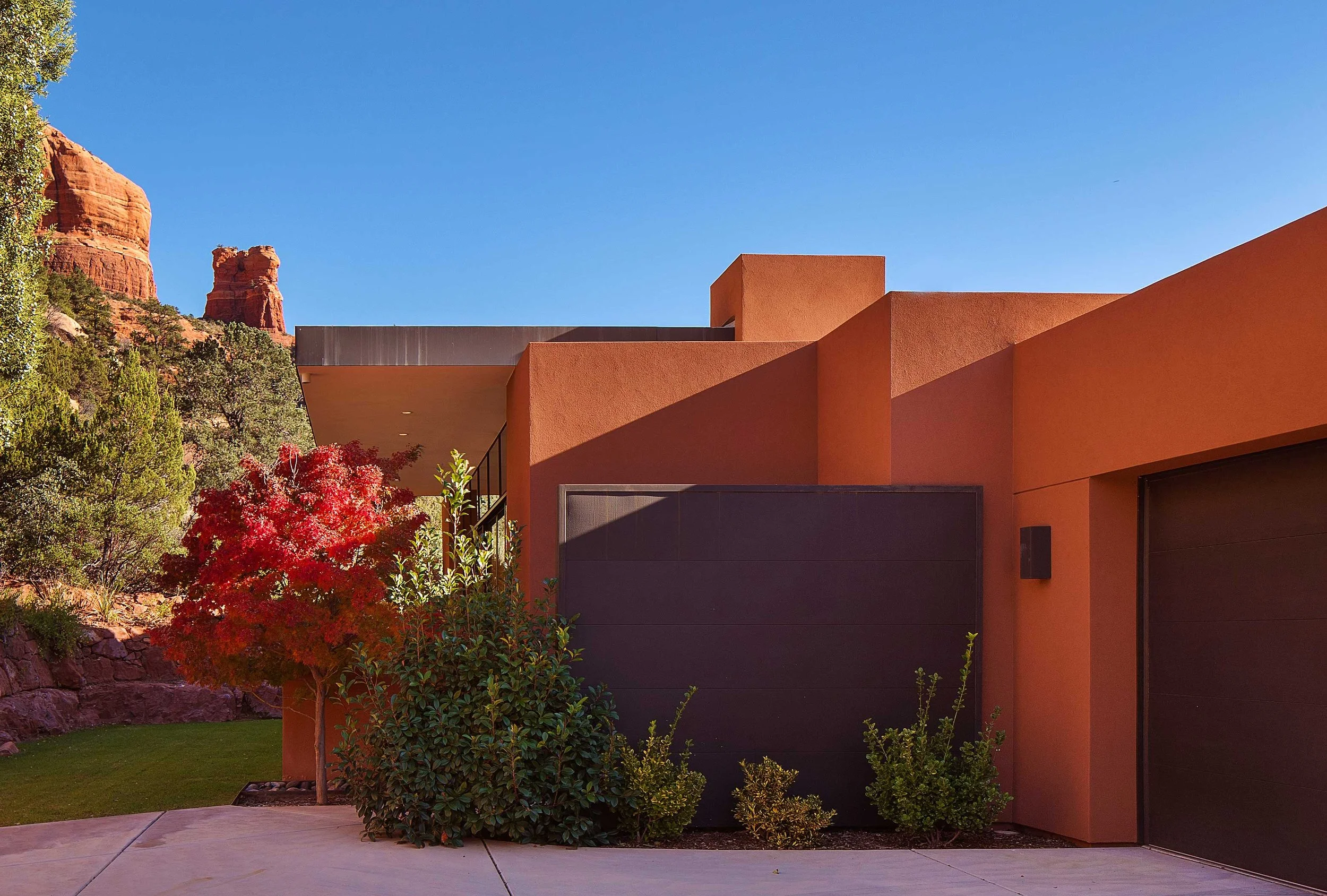 Vibrant southwestern home surrounded by natural greenery. 