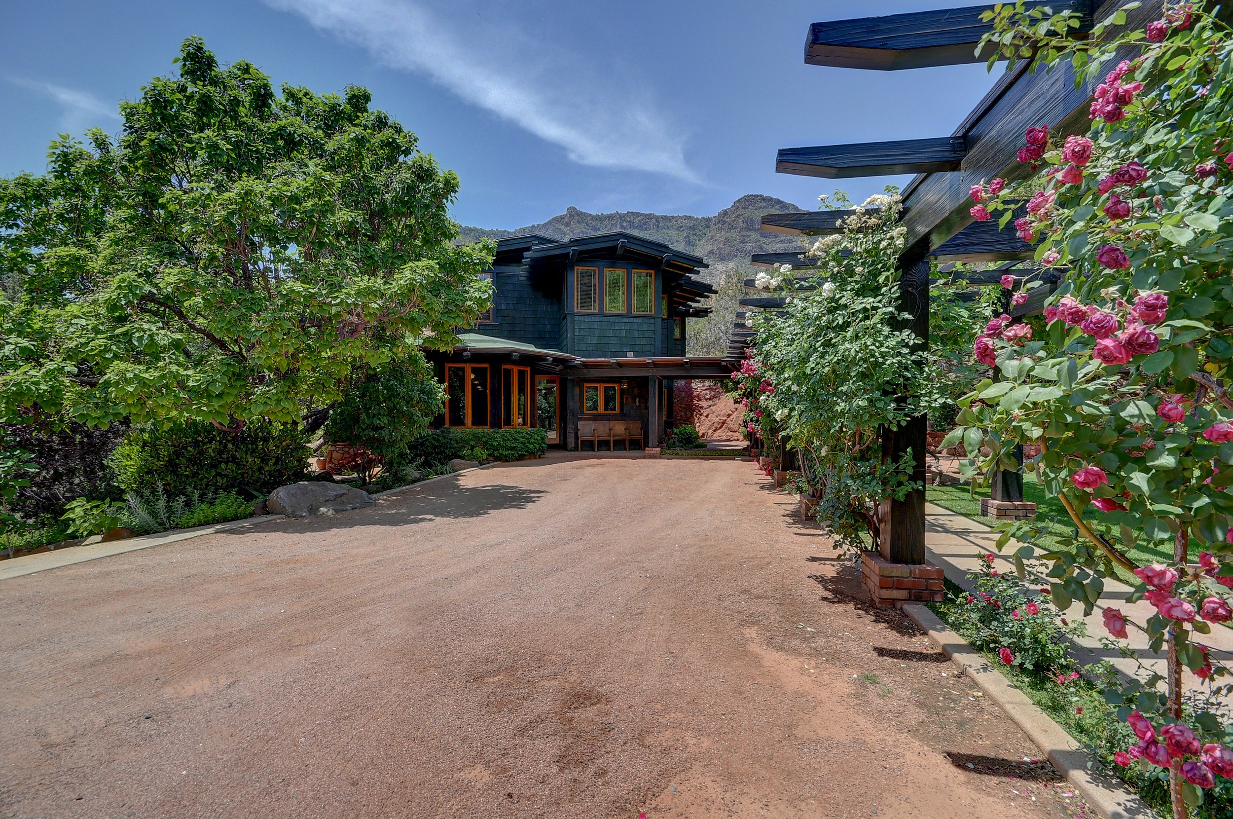 Lined with a long trellis, this driveway carries you home to a private retreat outside of Sedona. 