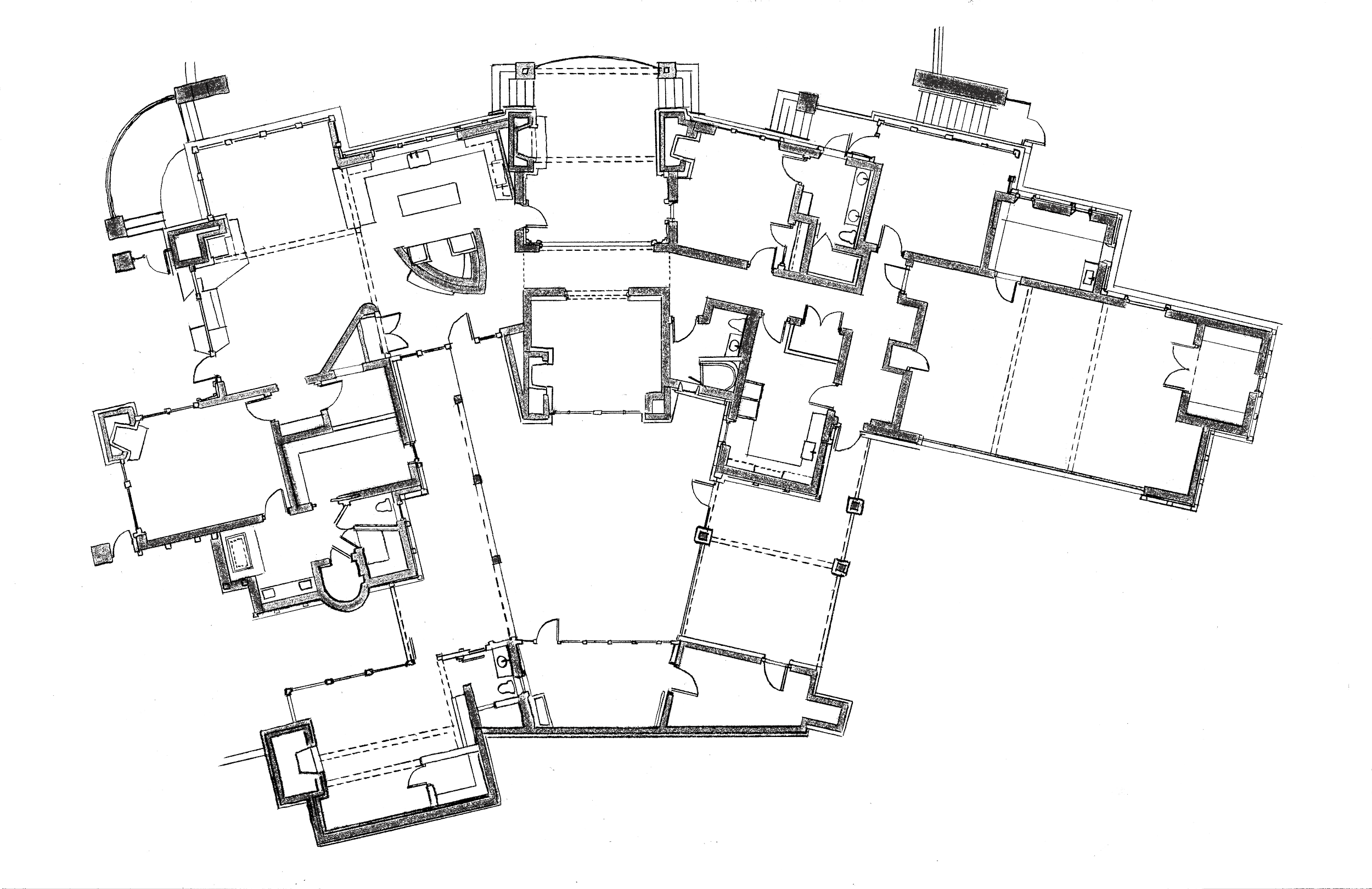 Floor plan of a building with multiple rooms, corridors, and structural details in white on a black background.