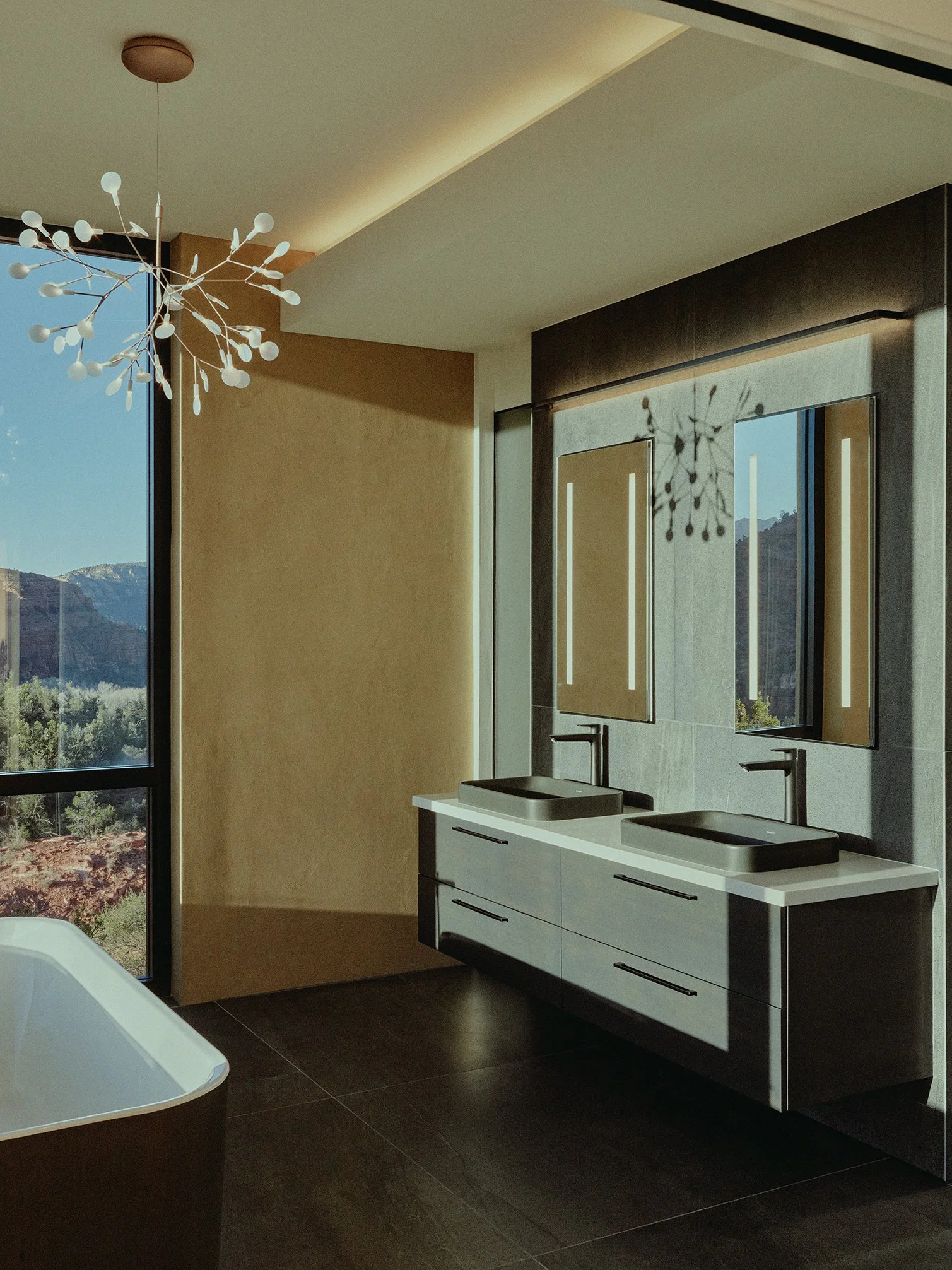 illuminated mirror vessel sinks stand alone bathtub indirect lighting cove luxury private residence sedona arizona