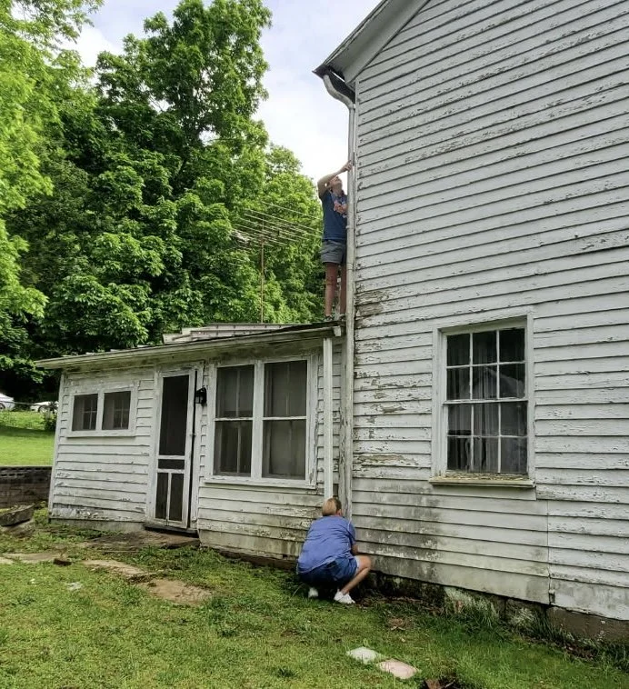 Fixing the down spout.
