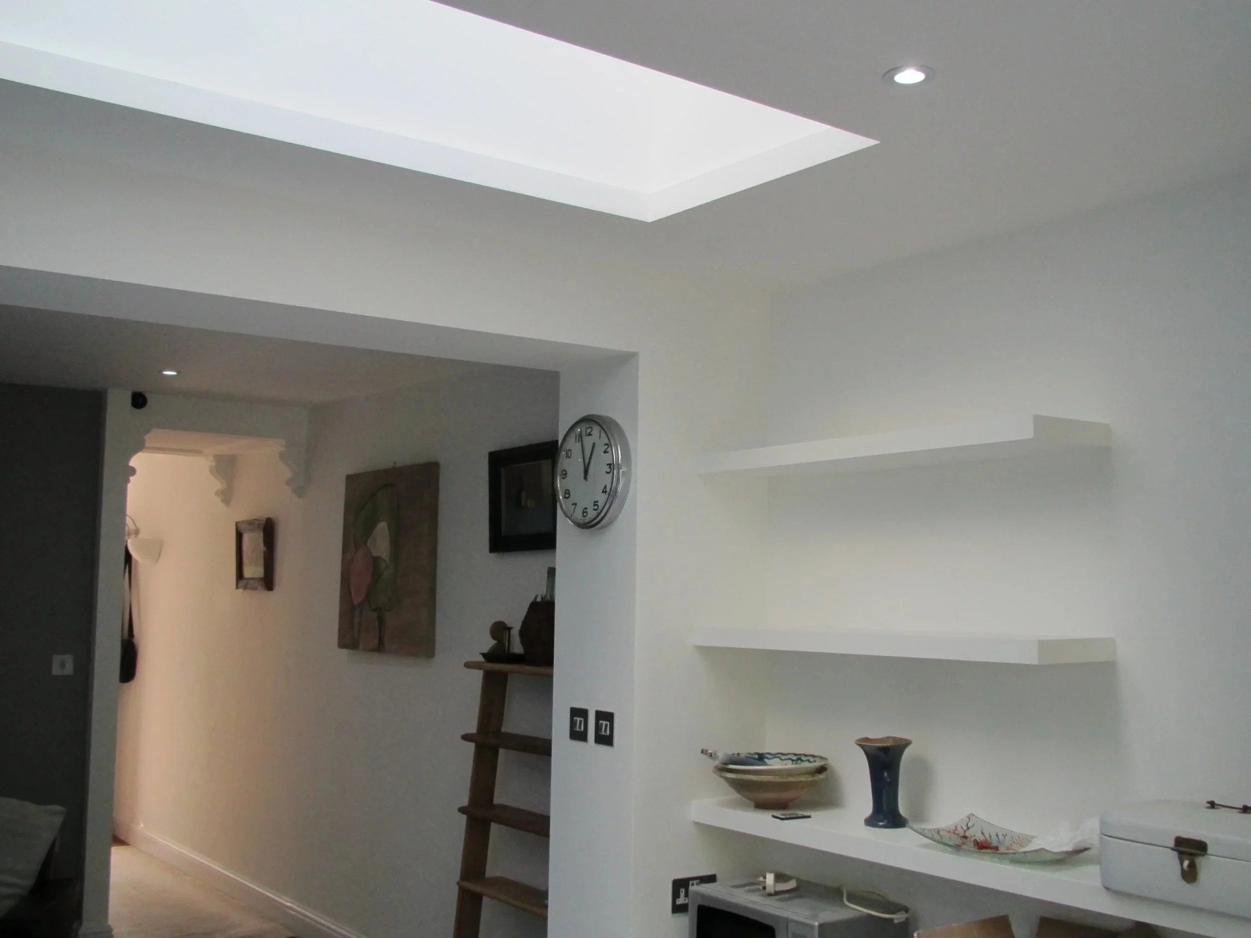Rooflight above the junction of the new kitchen and the hallway, with floating shelves at a rear kitchen extension on Short Road, Chiswick, W4 by Robin Services.