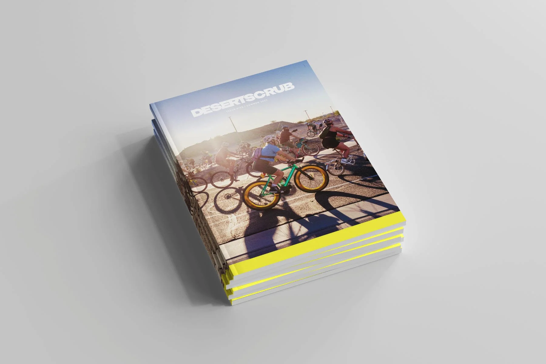 A stack of magazines with bicycles being ridden on the cover