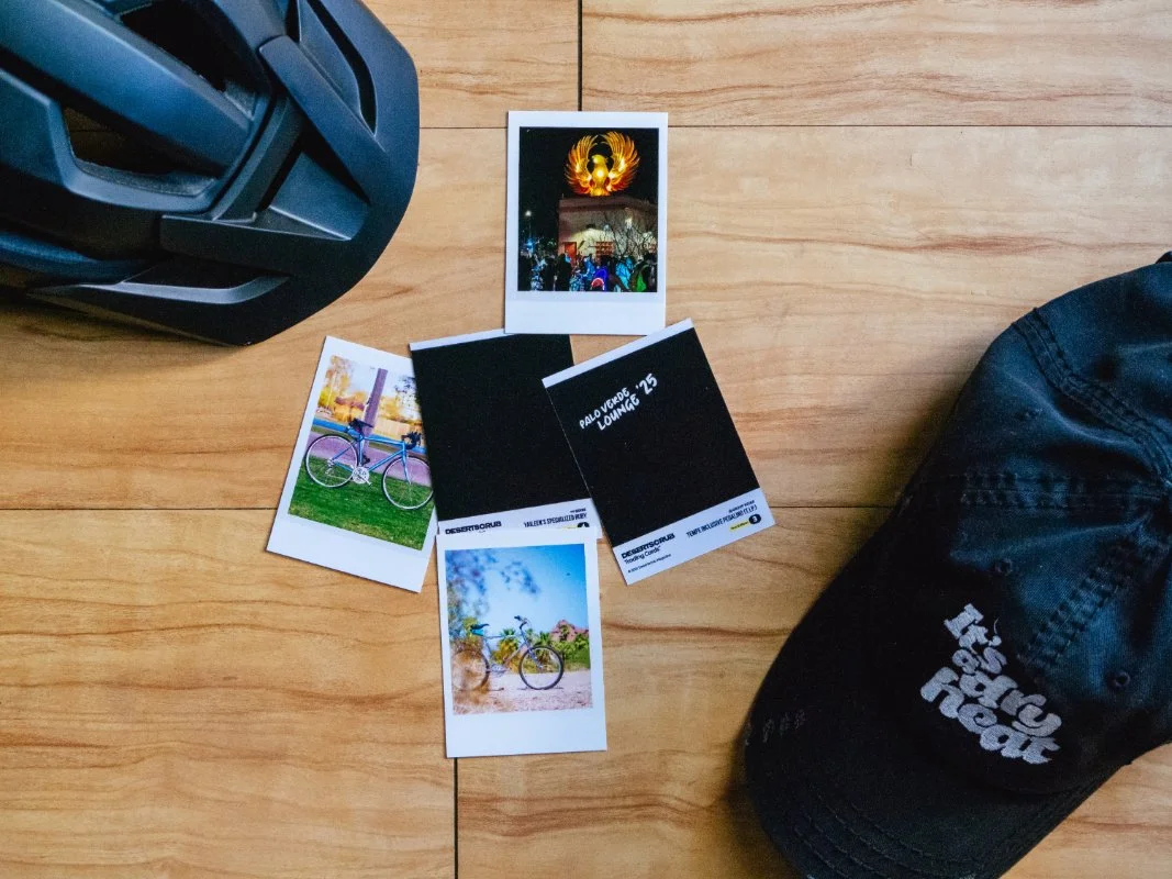 trading cards with bicycles, a hat, and a helmet on the floor