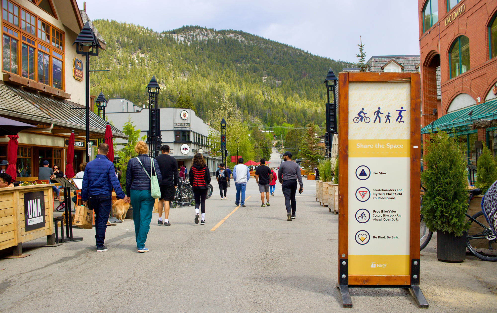 Smaller, tourism-focused towns and cities often recognize the benefits of car-free streets to promote ease and walkability for visitors and residents alike. Photo taken in Banff, AB by Nicole Roach, 2024.