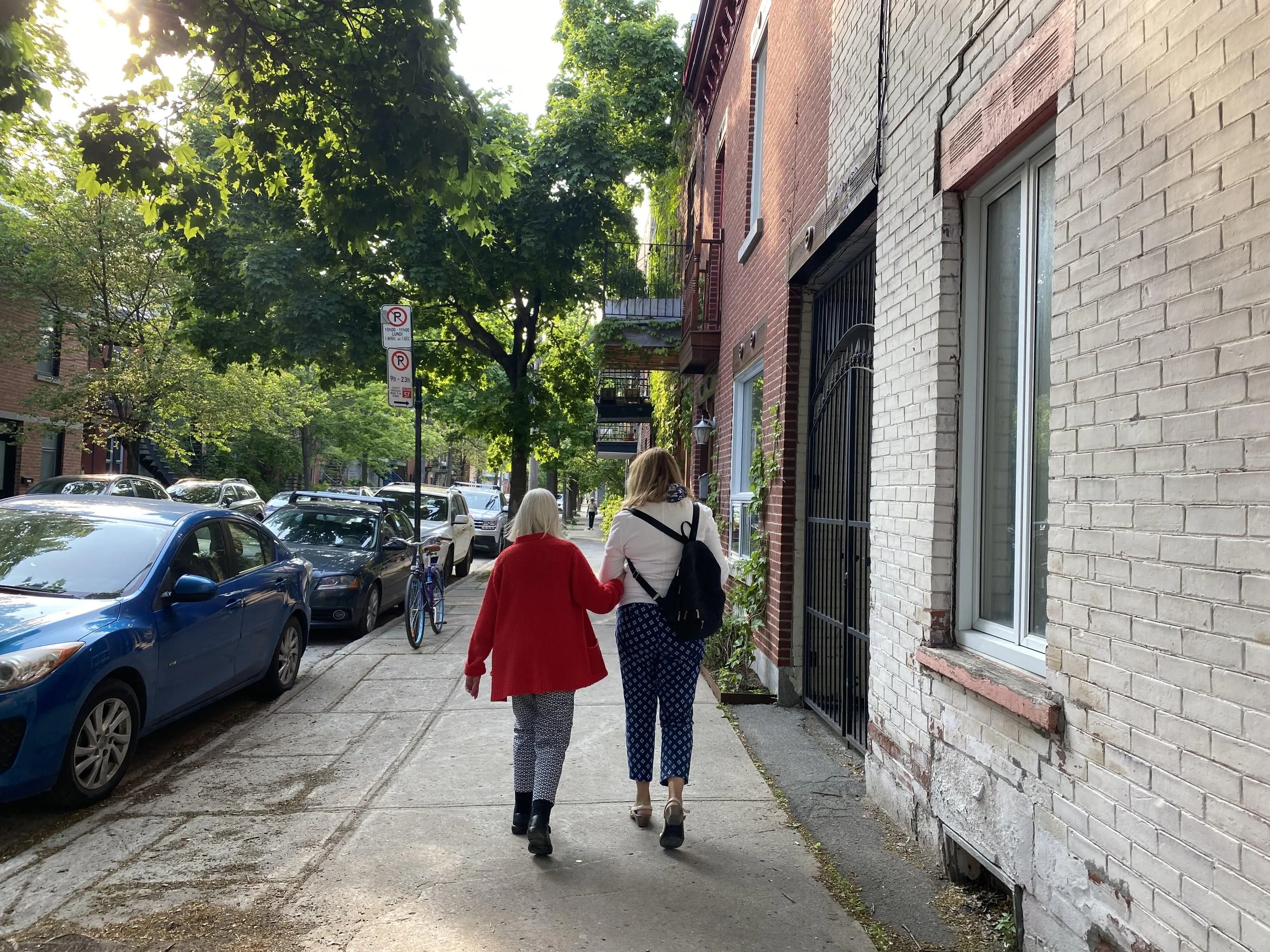 Women walking down a Montreal sidewalk, photo taken by Holly Hixson