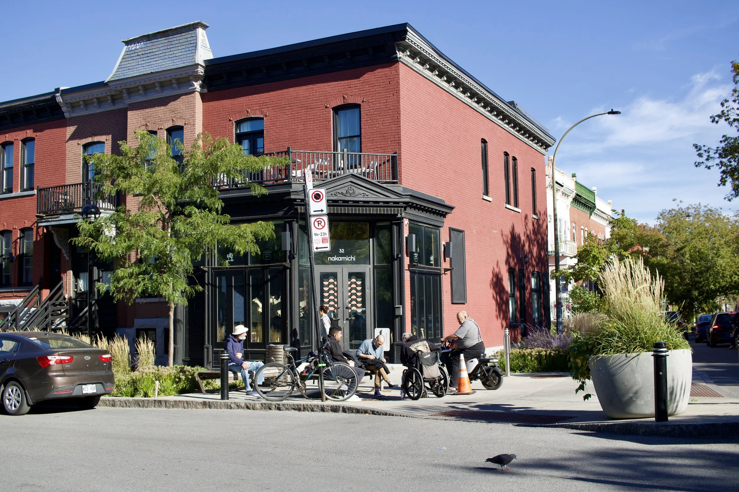 A group of men enjoying a street corner in Montreal, QC. Photo taken by Nicole Roach.