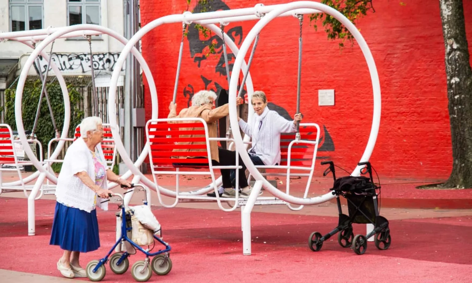 Three elderly women enjoying an colourful and accessible public space in Copenhagen, Denmark.