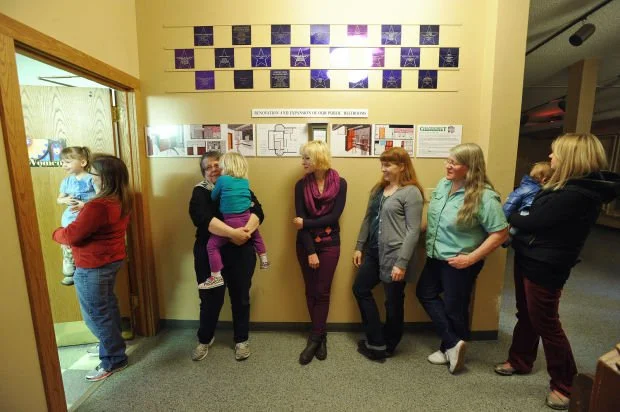 Women waiting in line-up to use the washroom. Photo via Potty Parity E-Quips.