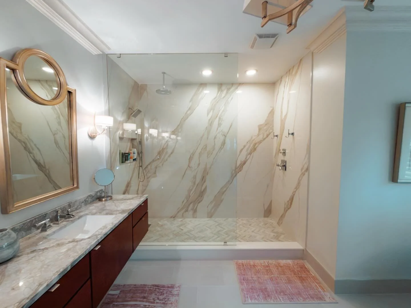 Quiet luxury, built for real life.

This Milton primary bath was designed to feel open, calm, and elevated, without sacrificing function.

What you&rsquo;re seeing:
&bull; Large format marble look wall panels for a seamless finish
&bull; Frameless gl