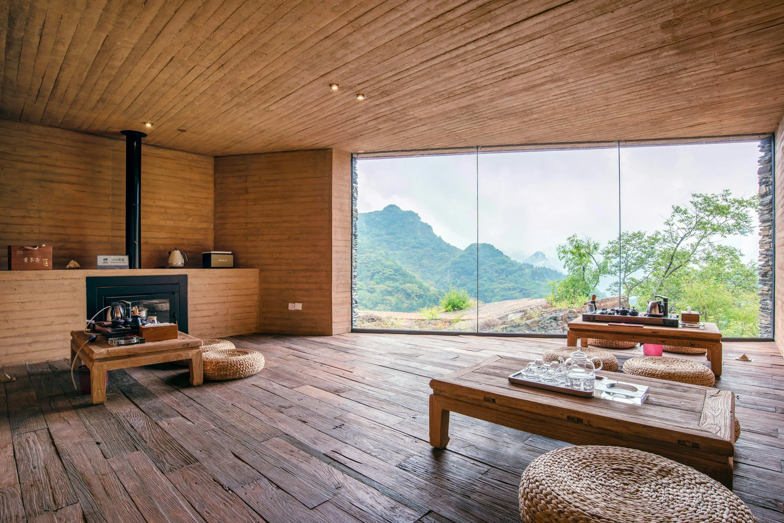 Restorative hotel room with natural materials and landscape views illustrating recovery hospitality beyond the spa.