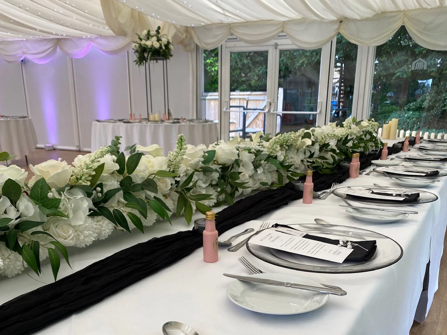 Grace top table floral garland with white flowers and greenery