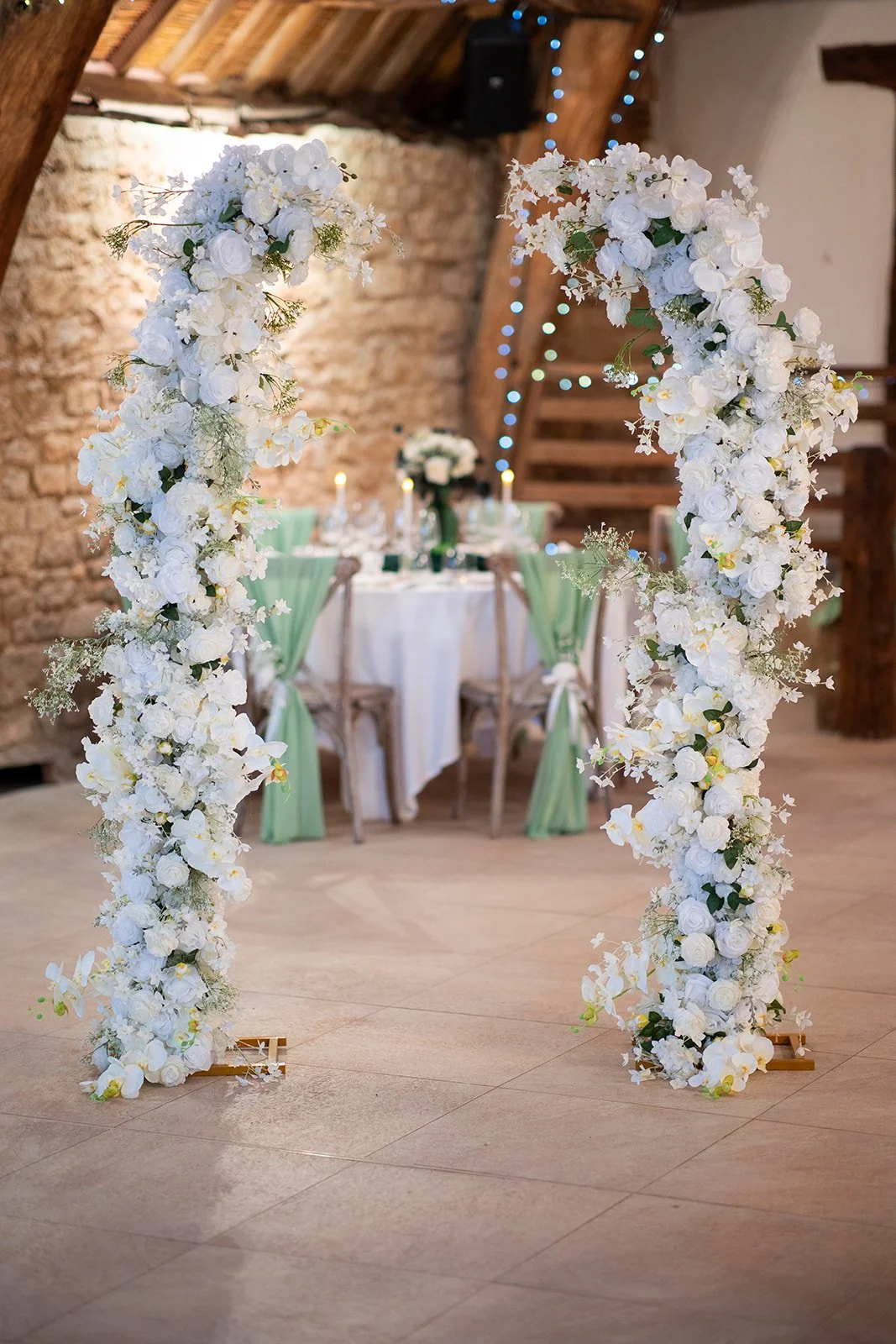Luxury Tiffany white rose and hydrangea flower arch available from Rosewood & Pearl for elegant wedding ceremony backdrop and décor hire.