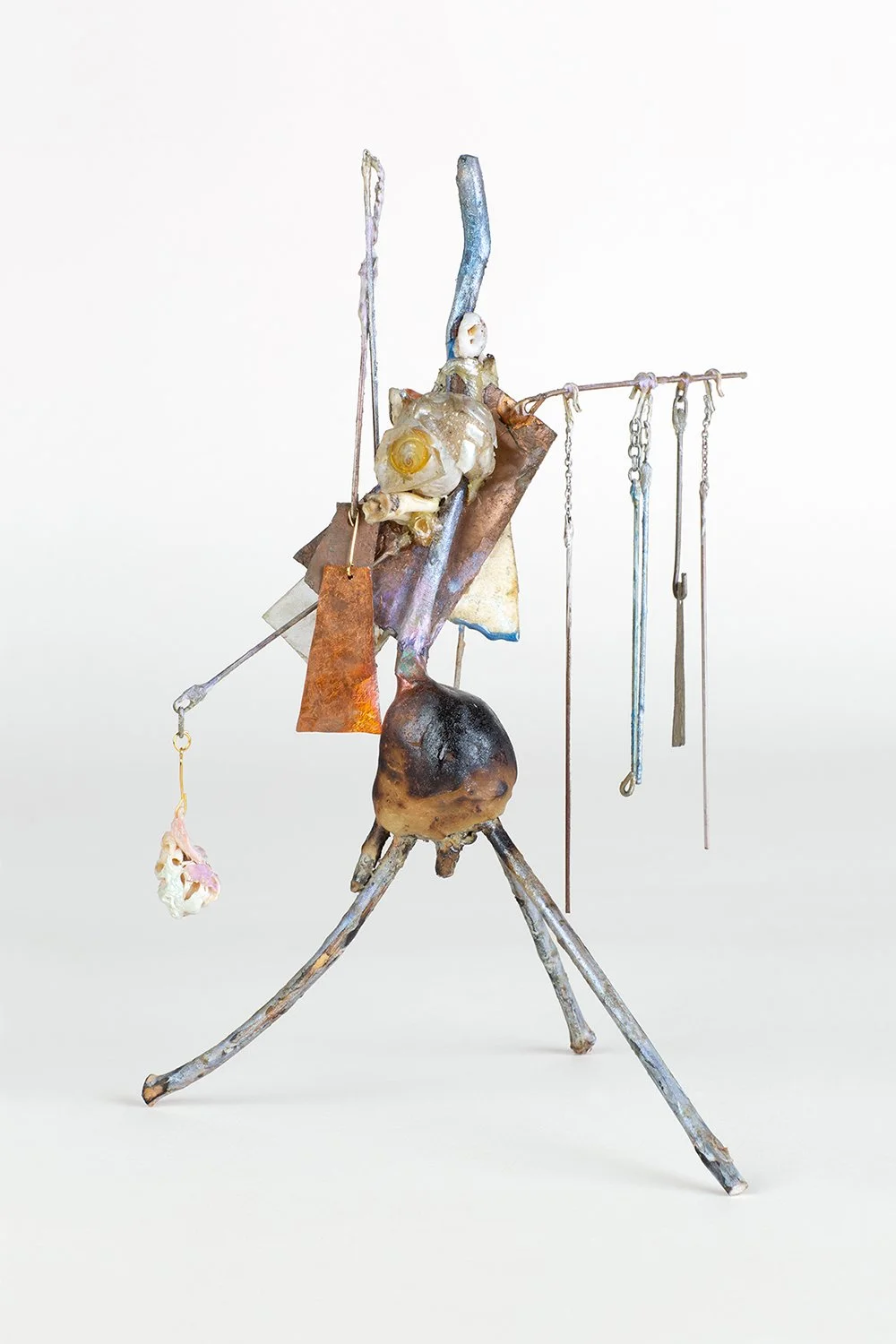 Yogi 2022 H11 x 7 x 7 ½ inch metallic oil paint on found tree branches, copper, brass, found sheet glass, polyester resin coated cardboard, pigmented epoxy resin, steel, steel chain, alloys of silver and copper