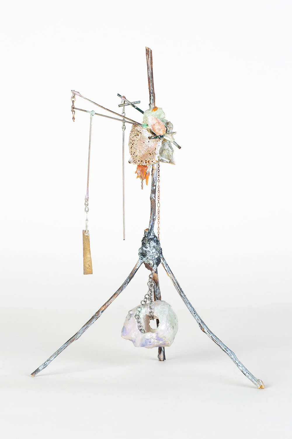 Justitia 2022 H13 x 5 x 10 inch metallic oil paint on found tree branches, seashells, brass, pigmented epoxy resin coated animal bones, polyester resin coated origami, steel, steel chain, alloys of silver and copper