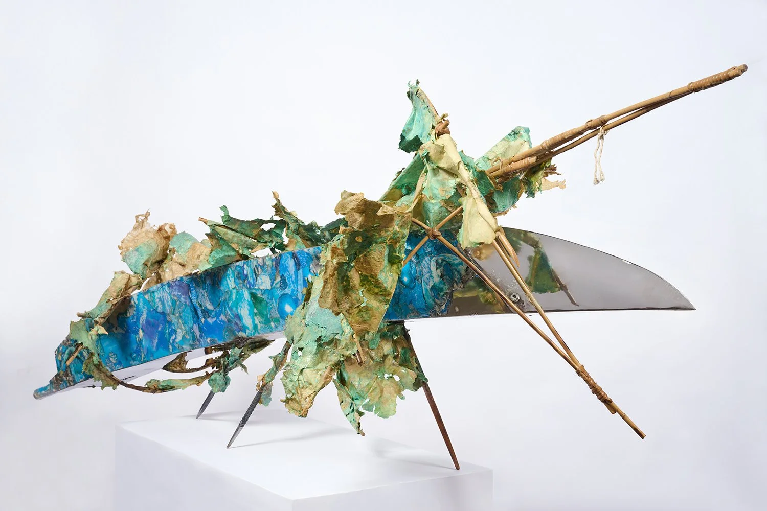  Bullet Turquoise  2023  H30 x 94 x 36 inch  epoxy-encased paper collage on stainless steel, PVA resin coated kozo-washi, verdigris, steel, rebar, cane, and hemp 