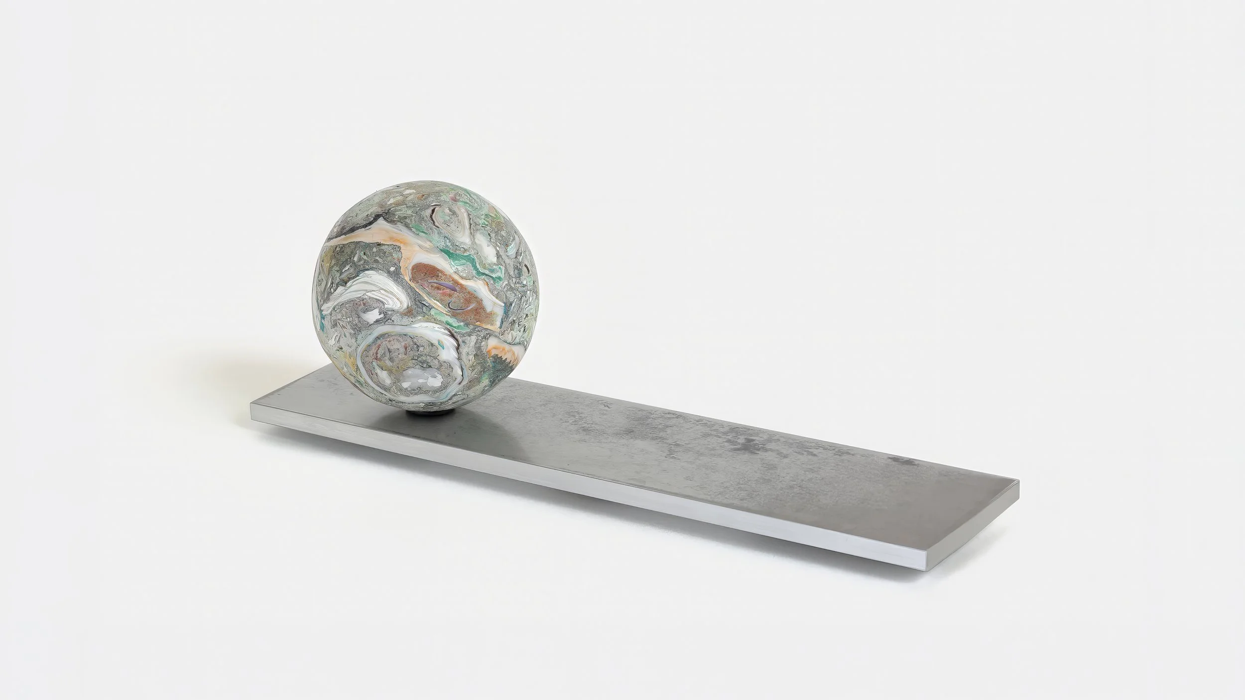 Yasue Maetake Orb Materia—Carved Algos: single carved sphere with green and earthy mineral textures resting on a long rectangular aluminum base against a plain white background