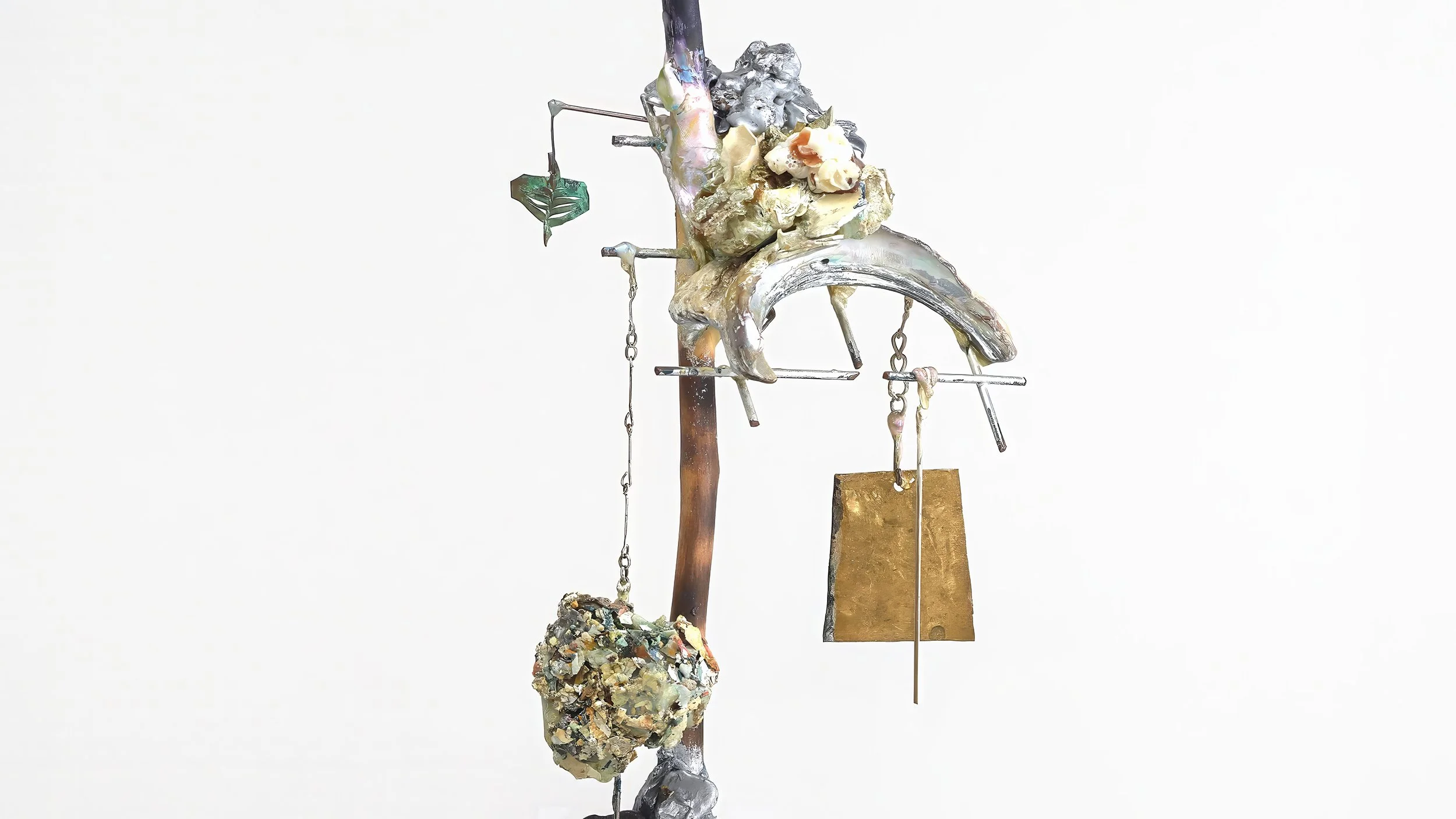 Yasue Maetake Three-Legged Idols detail: vertical assemblage with crescent-shaped form, hanging chains, metal plates, and a rough textured sphere against white background