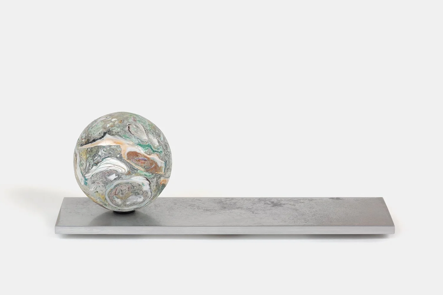 Orb Materia—Chlorophyll
(2026)
Hand-carved proprietary compound (marine calcite, polymer, marble) on aluminum base. H 3 3/4 x 10 x 3 in