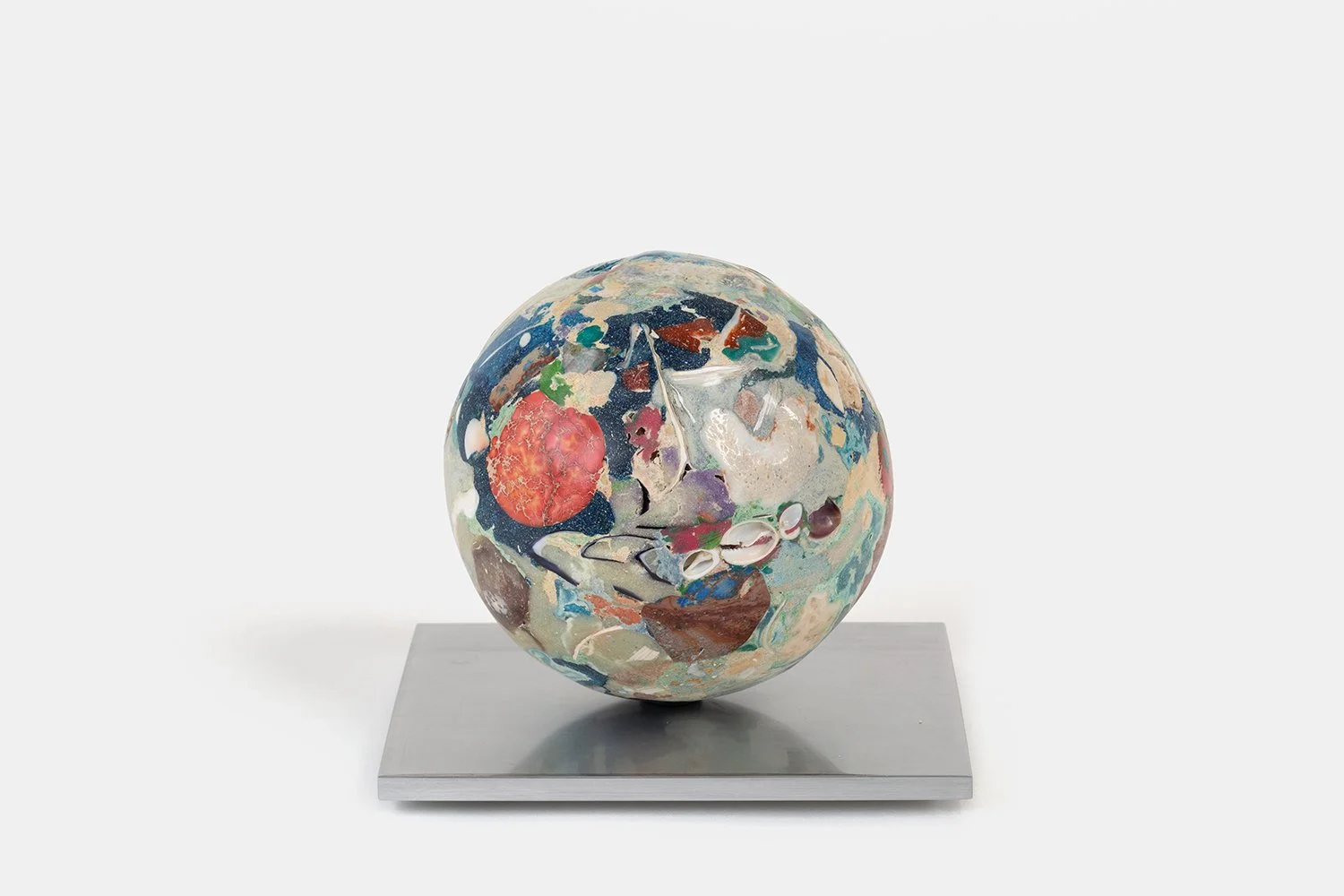 Orb Materia—Chigiri-e
(2026)
Hand-carved proprietary compound (marine calcite, jasper, sea glass, turquoise, agata, hydroxyapatite, soapstone, polymer, marble) on aluminum base. H 5 1/2 x 6 x 5 in