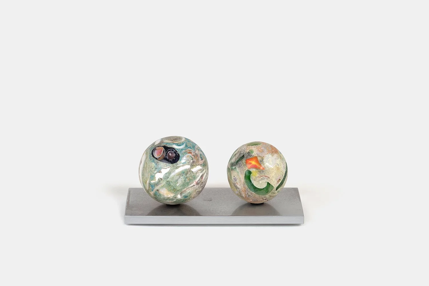Orb Materia—Blue First-Aid
(2026)
Hand-carved proprietary compound (marine calcite, polymer, sea glass, alabaster, marble) on aluminum base. H 3 3/8 x 5 x 3 in