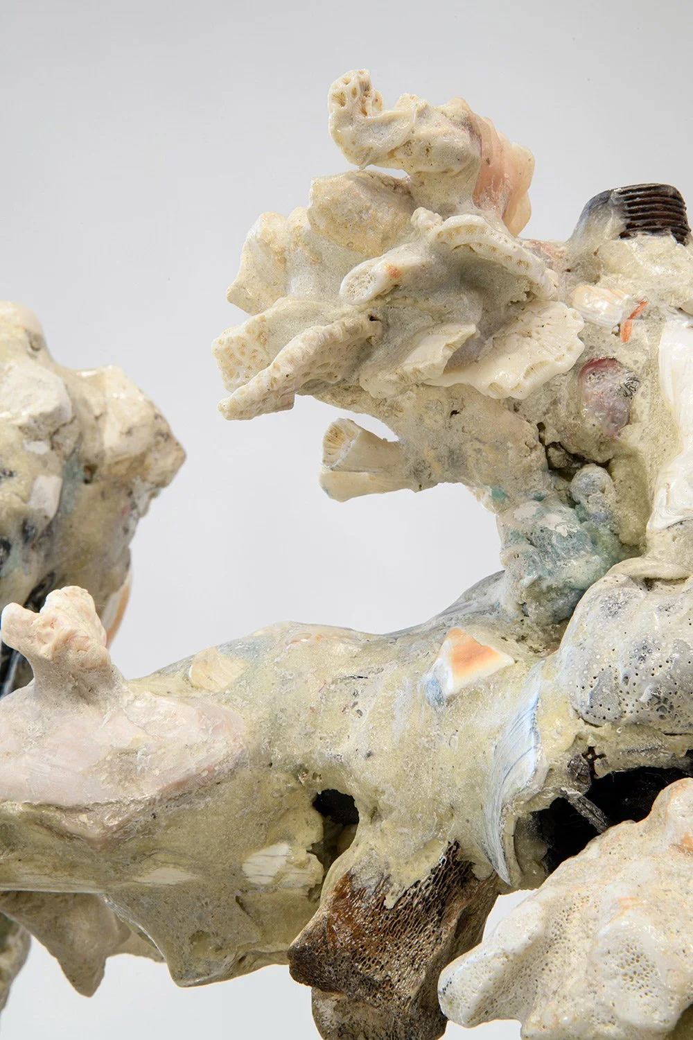 Yasue Maetake's sculpture Mare Fecunditatis – resurrection, 2025. Close-up detail of the intricate coral-like cluster showing highly porous white and gray forms with multicolored glazes and embedded organic materials.