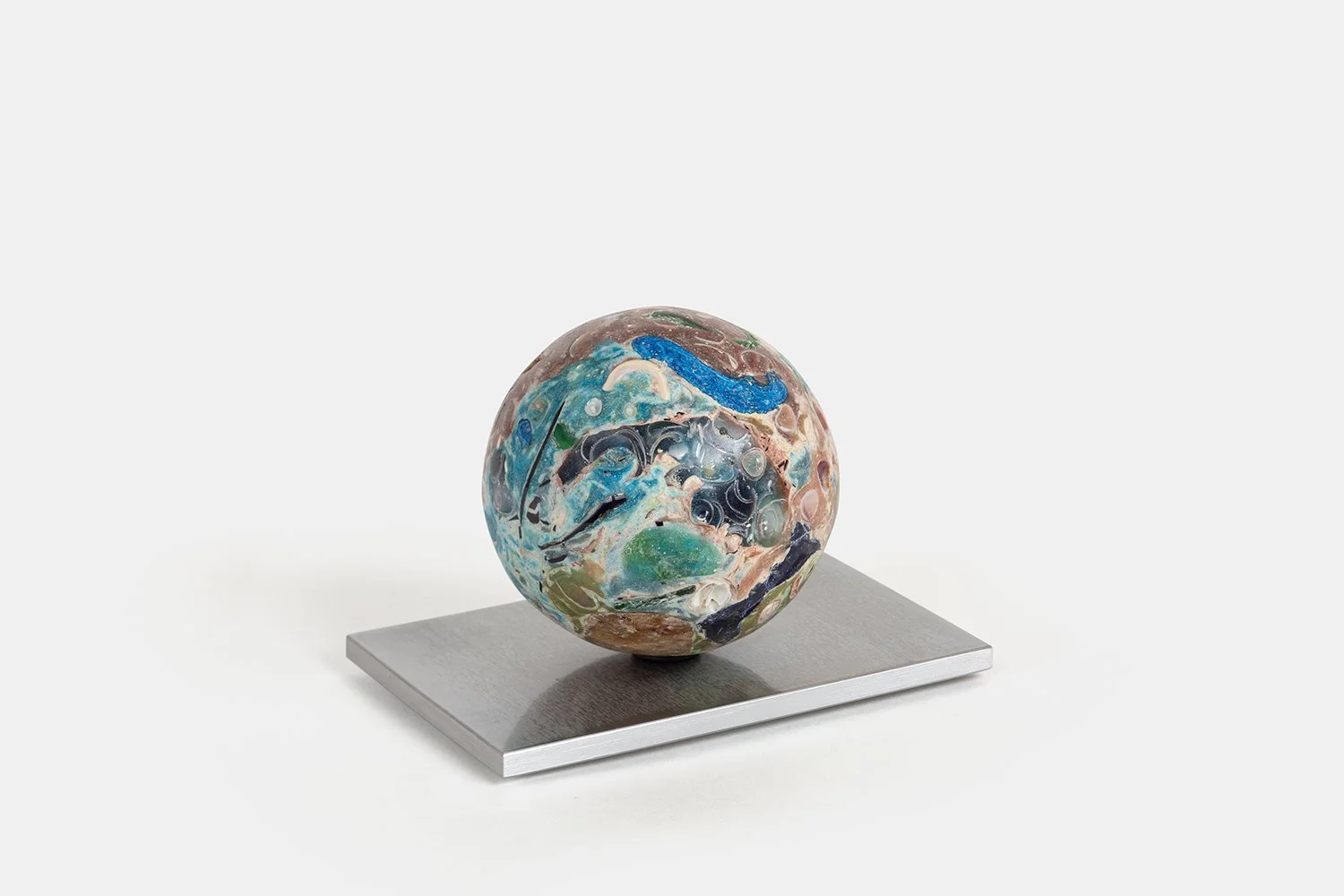 Orb Materia—Photosynthesis
(2026)
Hand-carved proprietary compound (marine calcite, polymer, sea glass, alabaster, marble) on  aluminum base. H 3 5/8 x 5 1/2 x 3 1/2 in