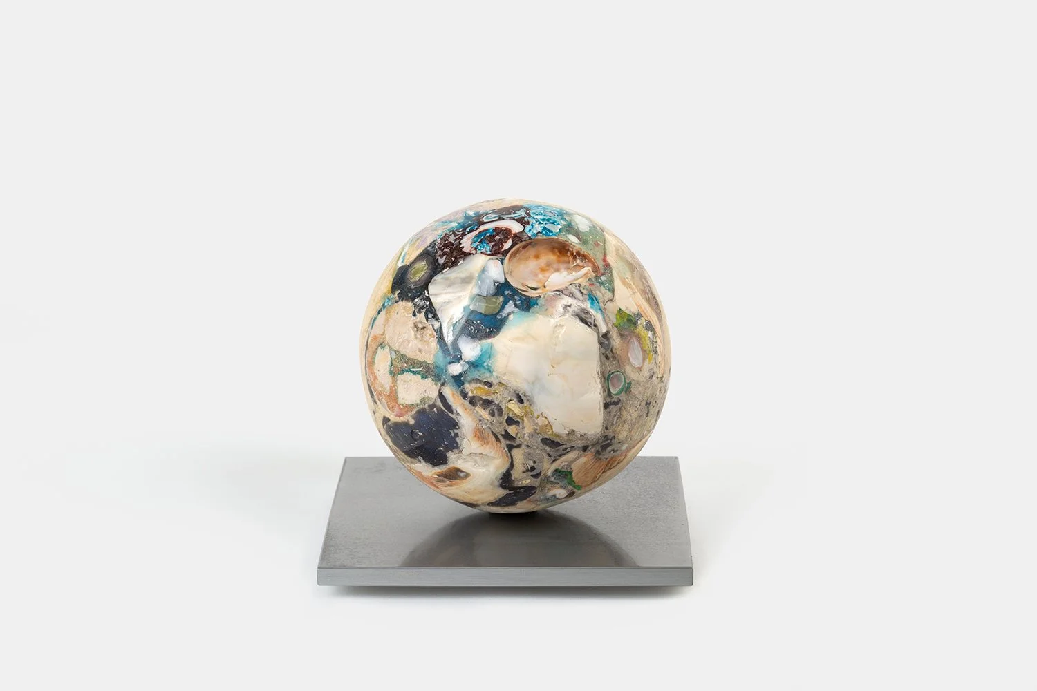 Orb Materia—Silken 
(2026)
Hand-carved proprietary compound (marine calcite, polymer, marble) on aluminum base. H 5 x 5 x 5 in